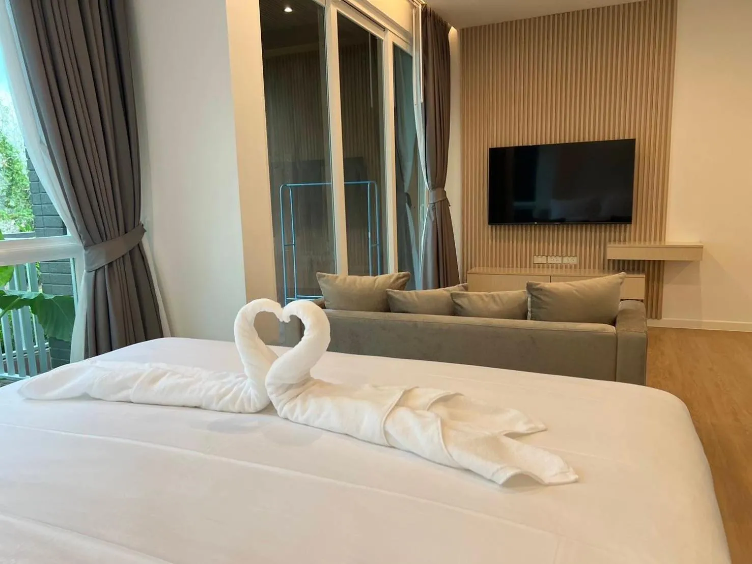Bed in Beachfront Bliss at Naiyang Phuket by ALPHATEL