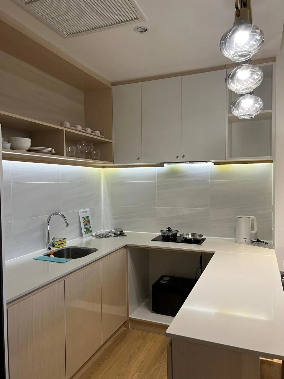 kitchen in Beachfront Bliss at Naiyang Phuket by ALPHATEL