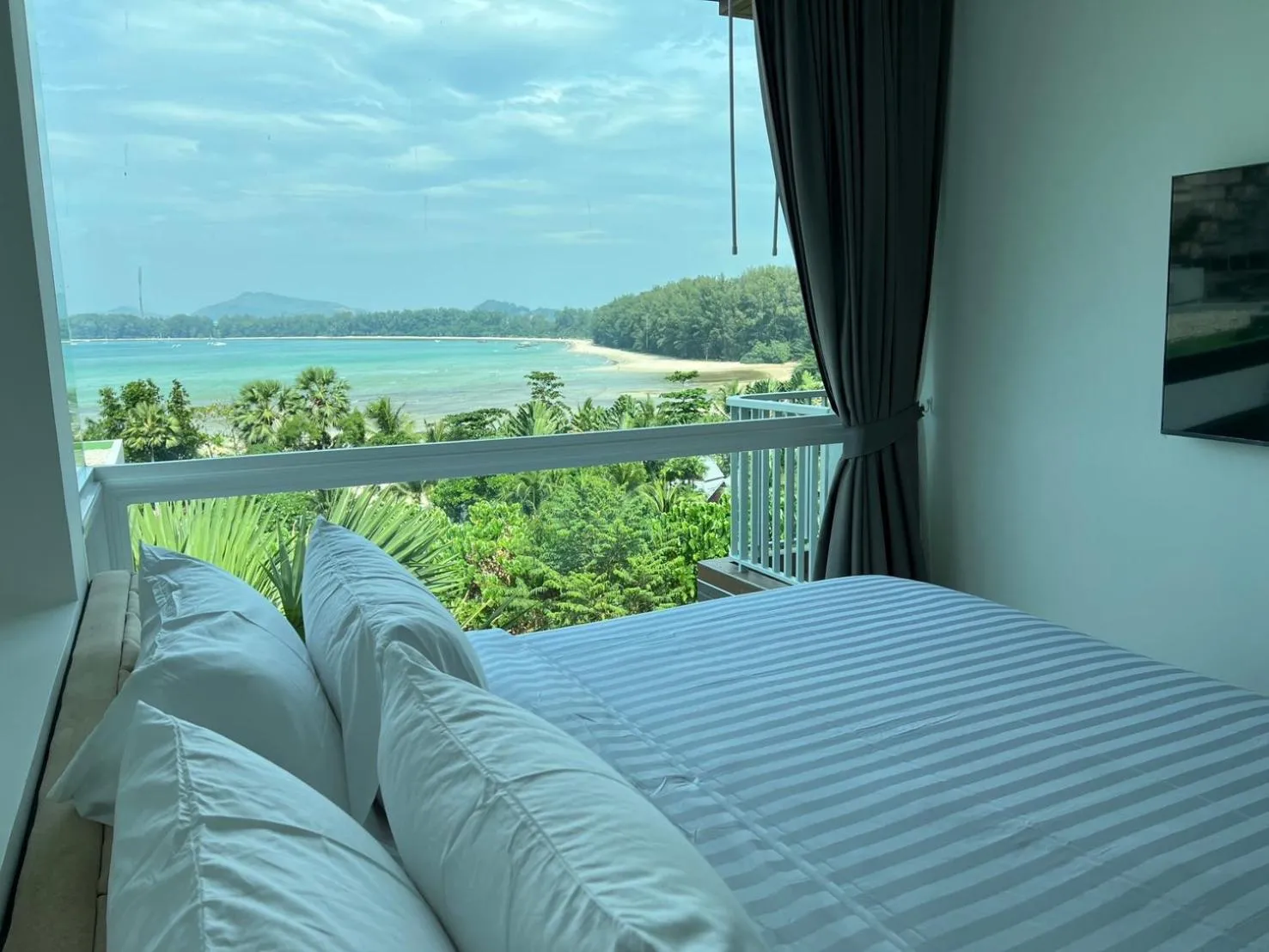 Bed in Beachfront Bliss at Naiyang Phuket by ALPHATEL