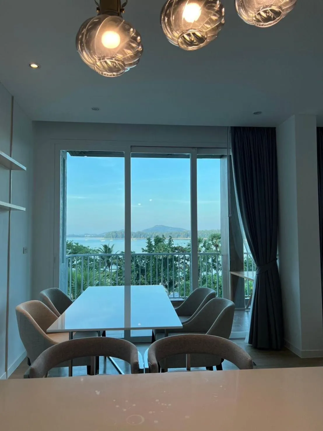 Dining area in Beachfront Bliss at Naiyang Phuket by ALPHATEL
