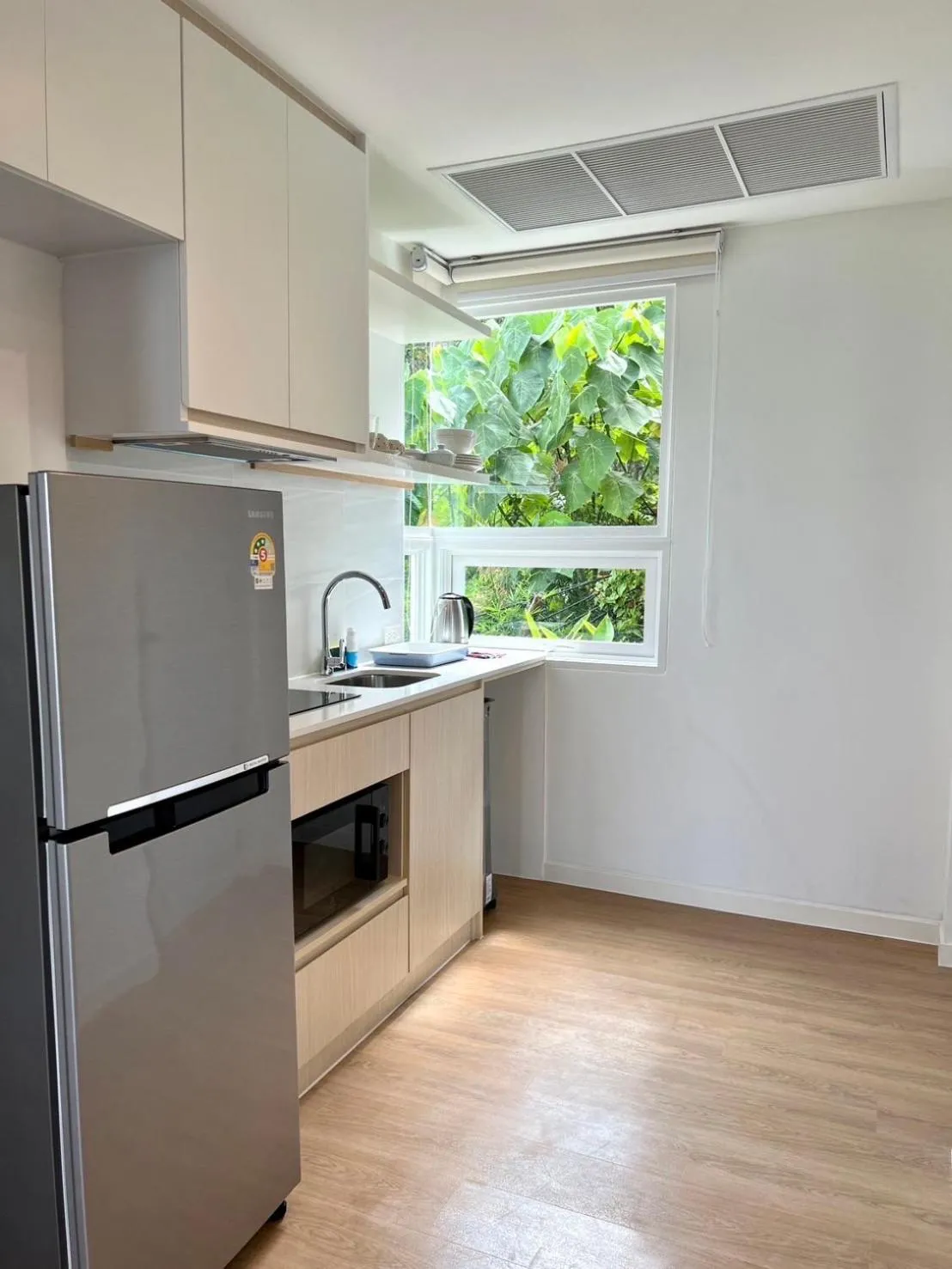 Kitchen or kitchenette in Beachfront Bliss at Naiyang Phuket by ALPHATEL