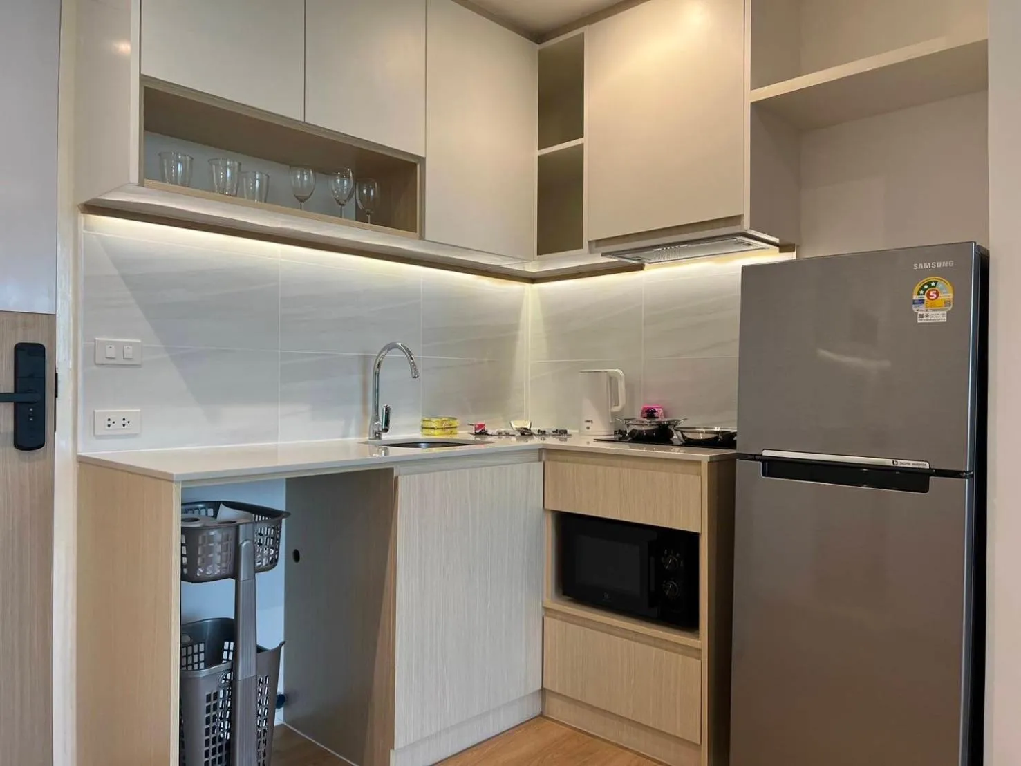 kitchen in Beachfront Bliss at Naiyang Phuket by ALPHATEL