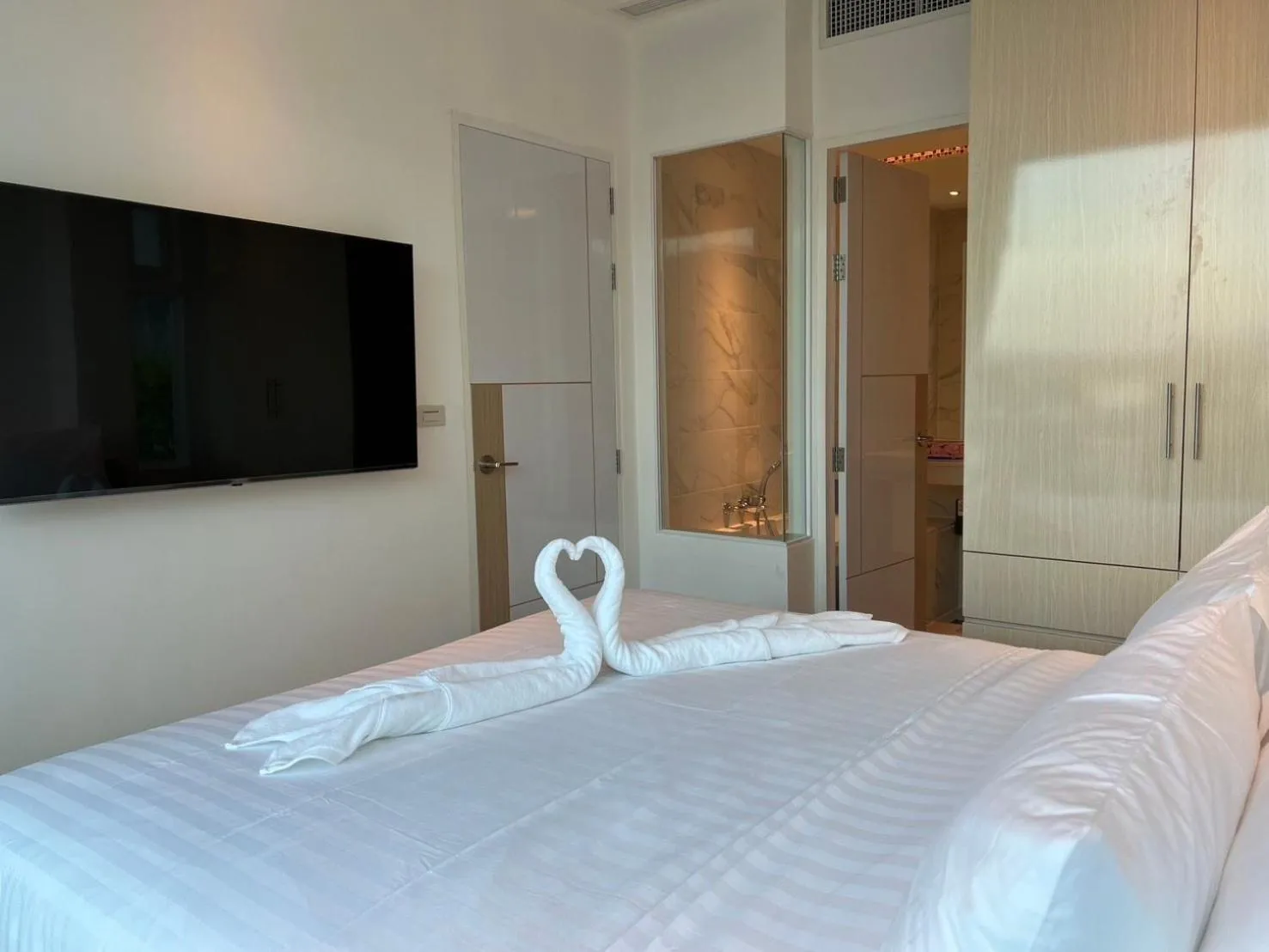 Bed in Beachfront Bliss at Naiyang Phuket by ALPHATEL
