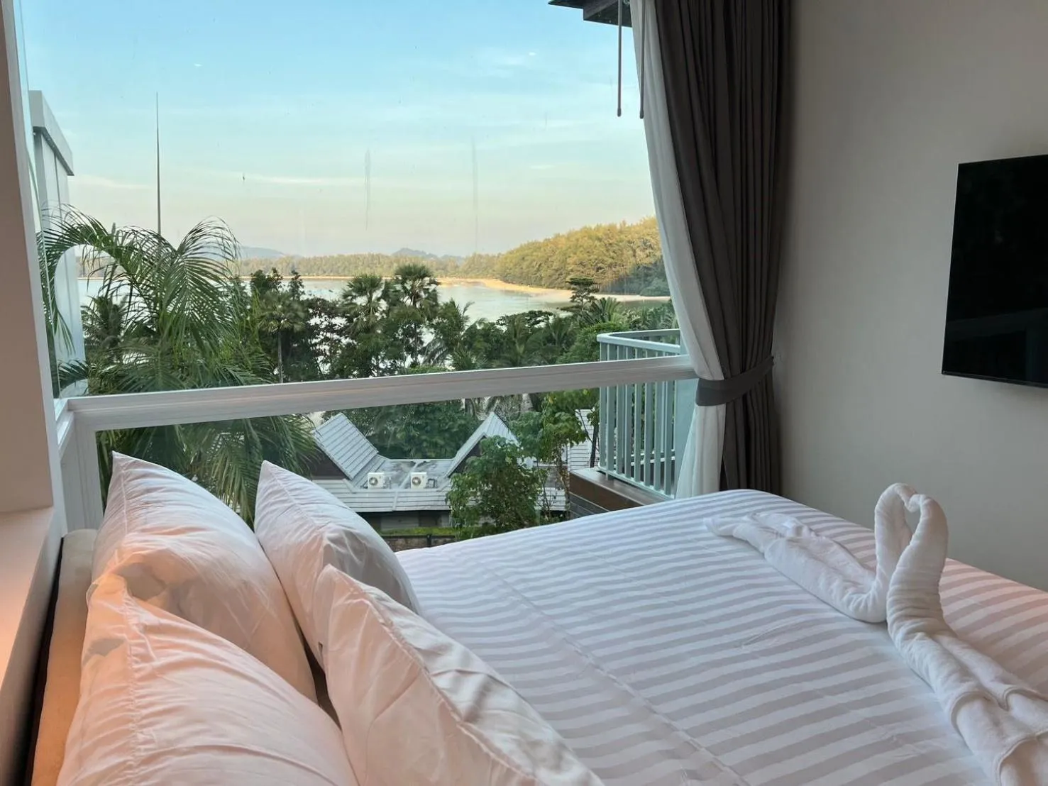 Sea view, Bed in Beachfront Bliss at Naiyang Phuket by ALPHATEL