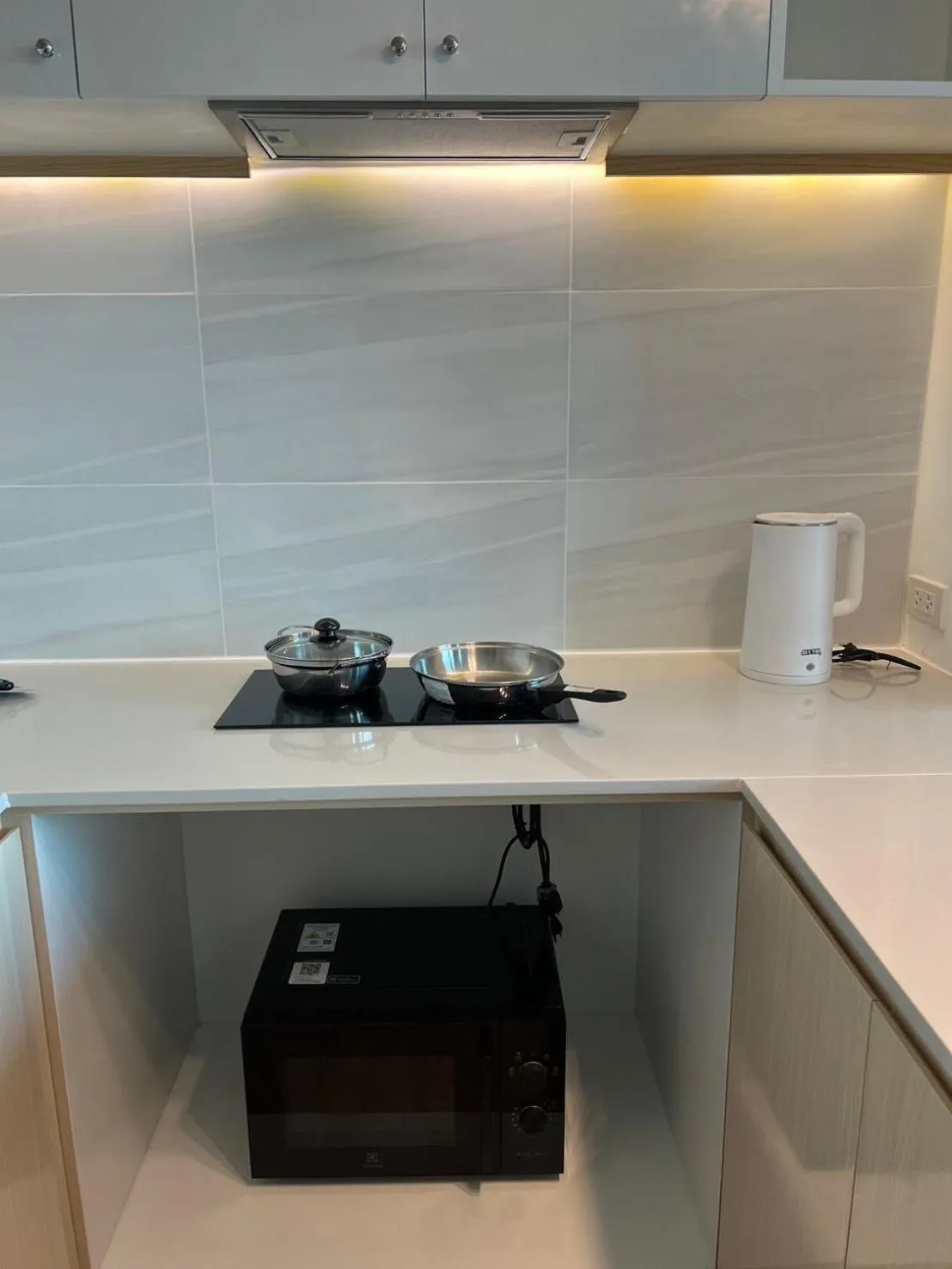 kitchen in Beachfront Bliss at Naiyang Phuket by ALPHATEL