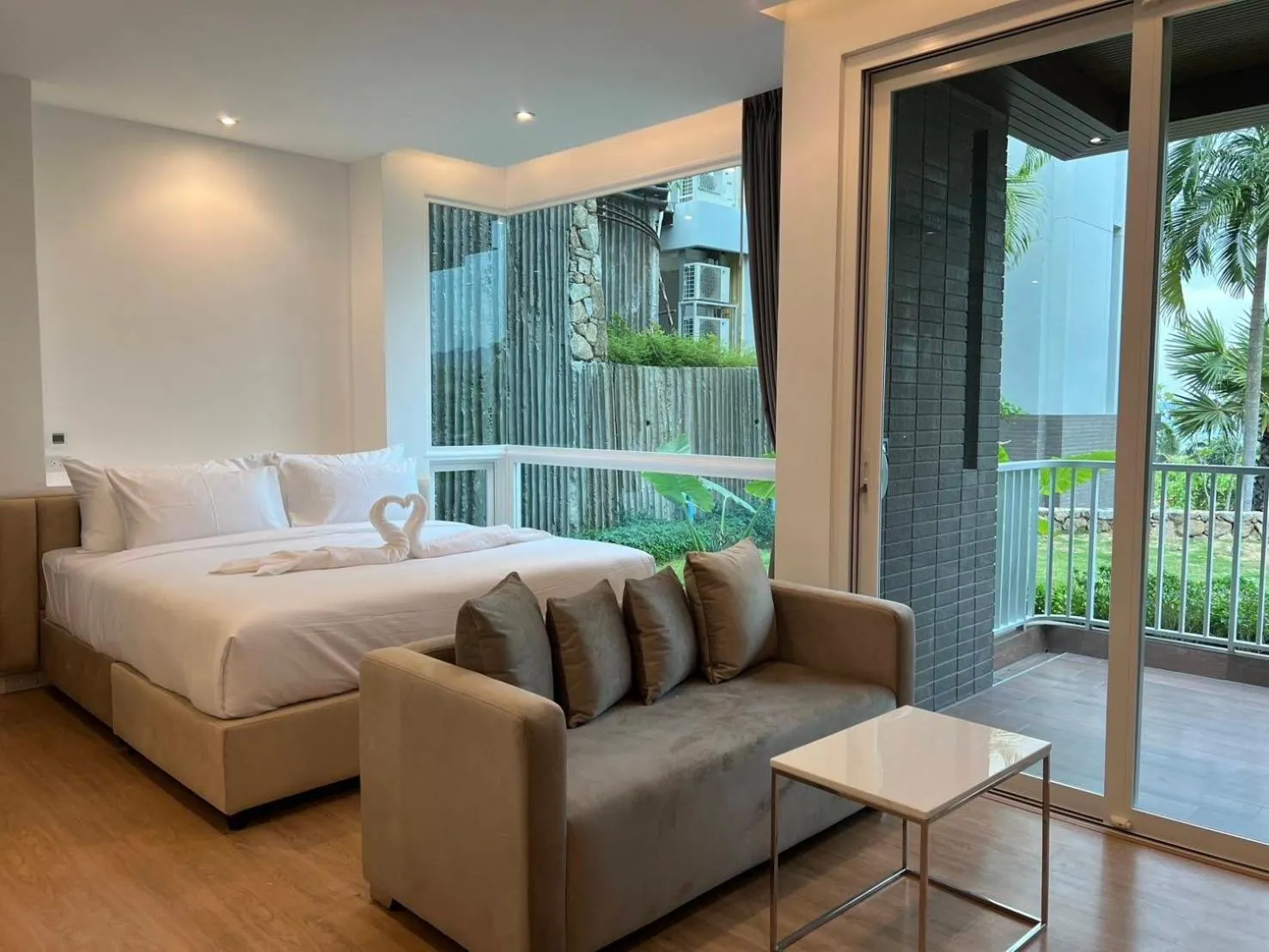 Seating area, Bed in Beachfront Bliss at Naiyang Phuket by ALPHATEL