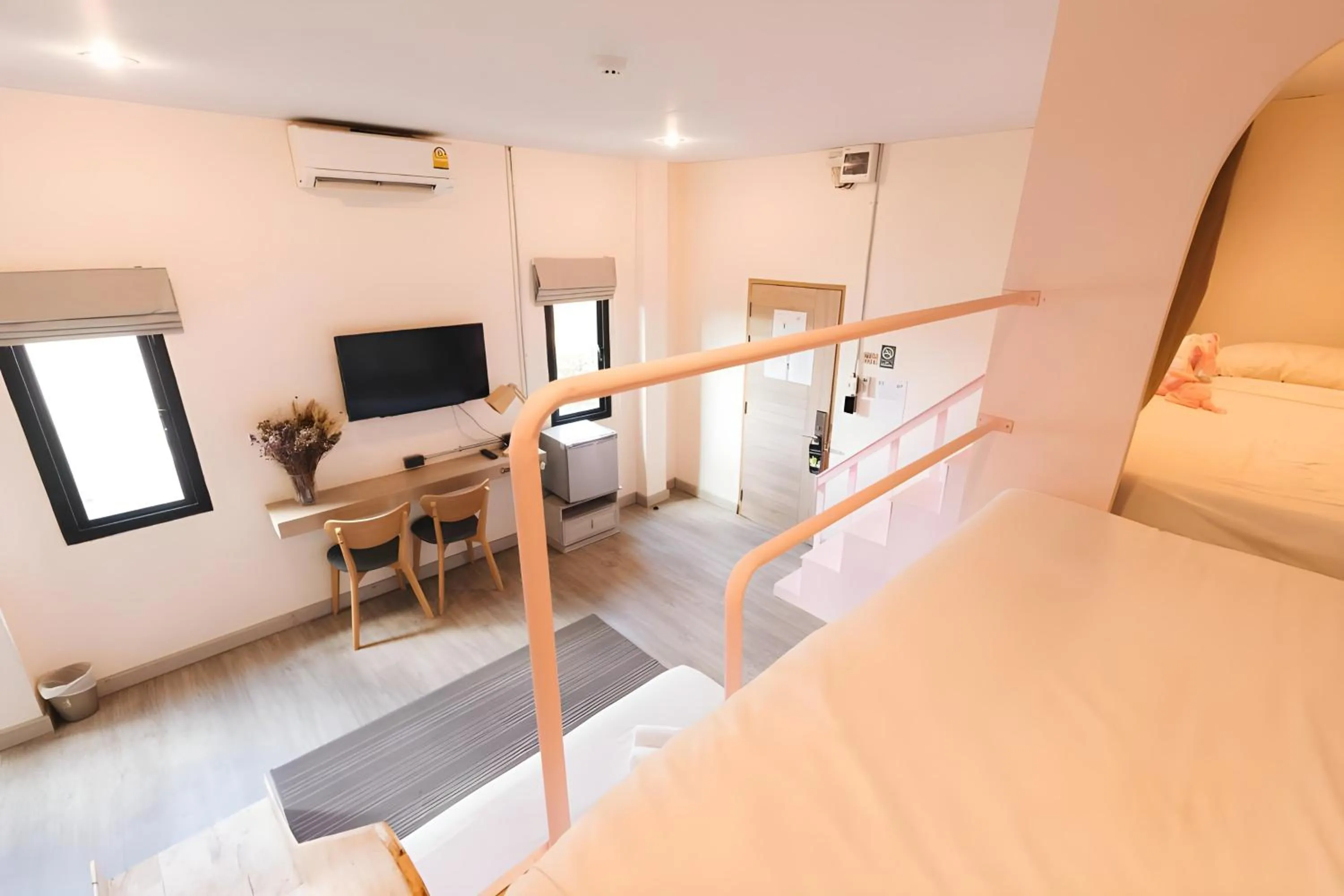 Communal lounge/ TV room, Bed in Mandalar Arch 39 Hotel