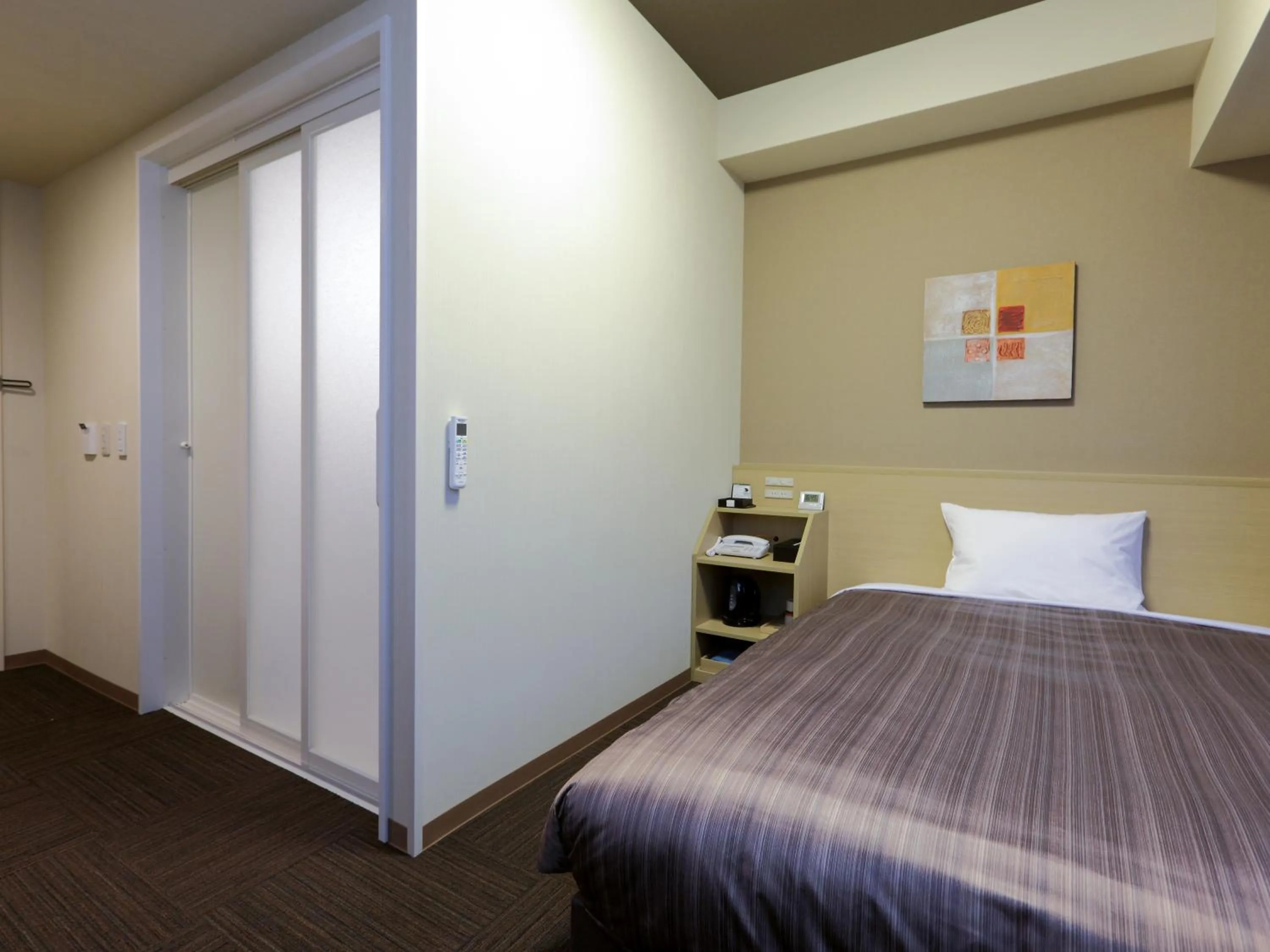 Photo of the whole room, Bed in Hotel Route Inn Hamamatsu Dealer Dori