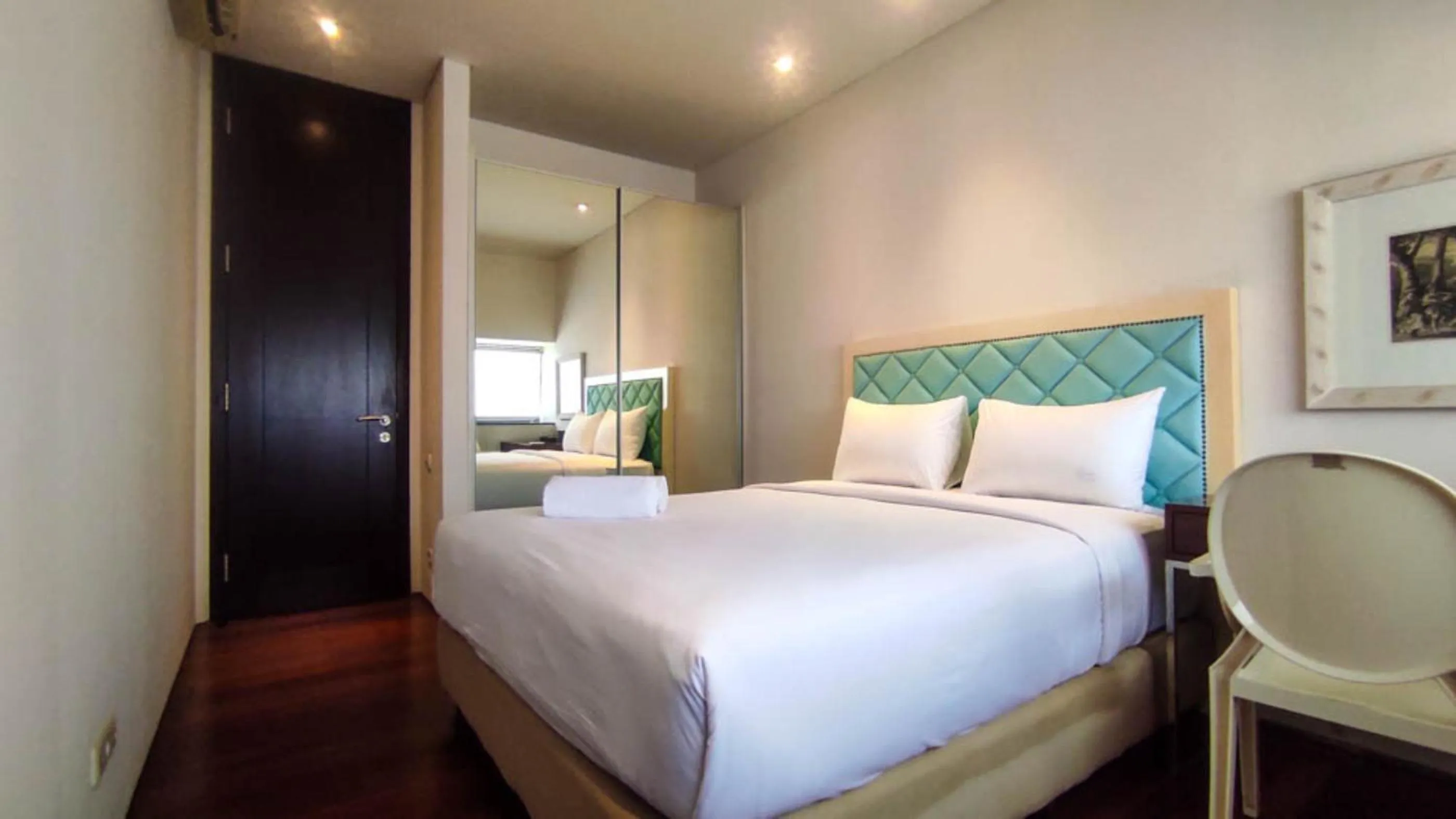 Bed in Apartment 3BR with River View in City Center at Sumatra36 Surabaya By Travelio