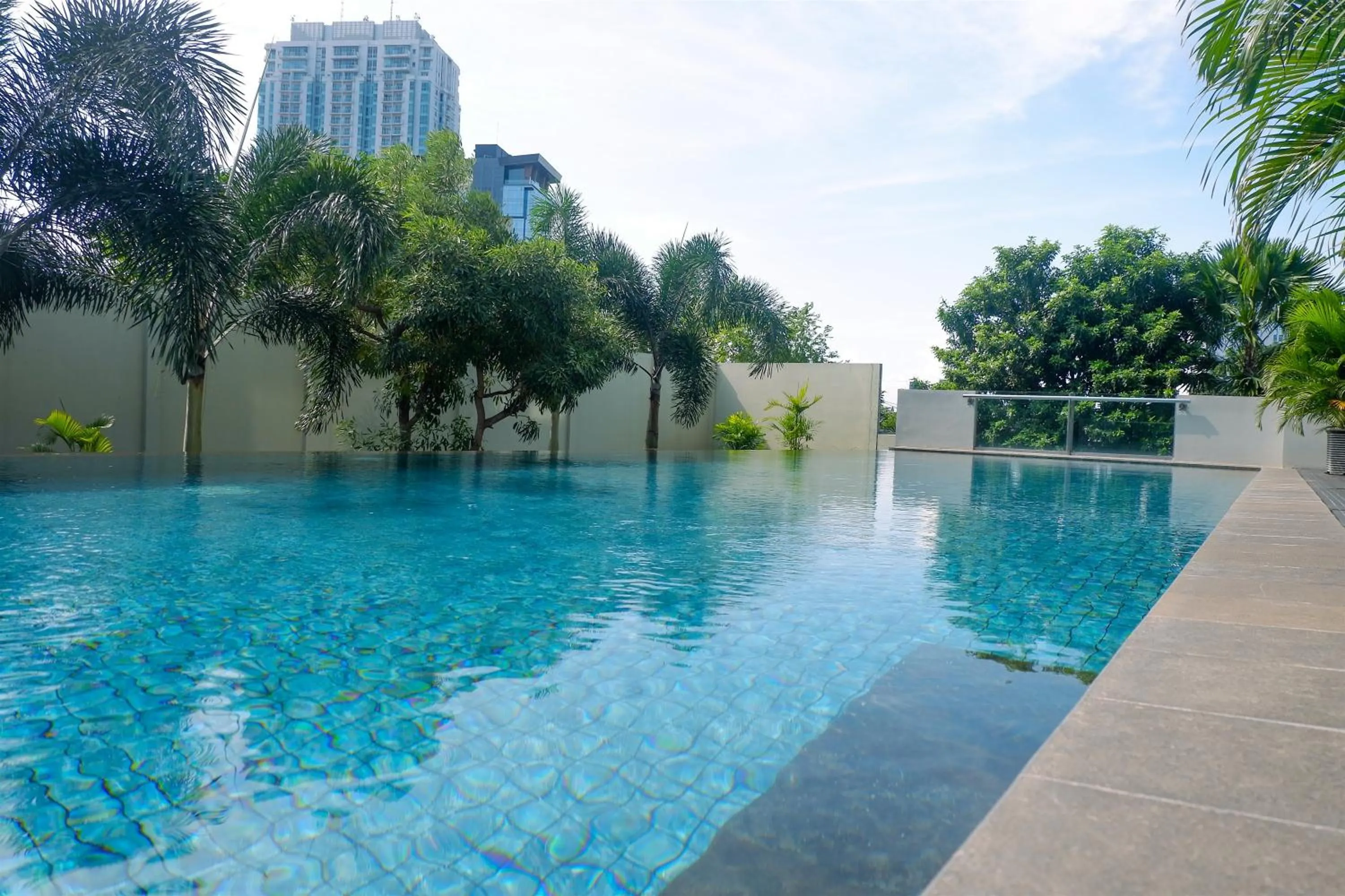 Swimming pool in Apartment 3BR with River View in City Center at Sumatra36 Surabaya By Travelio