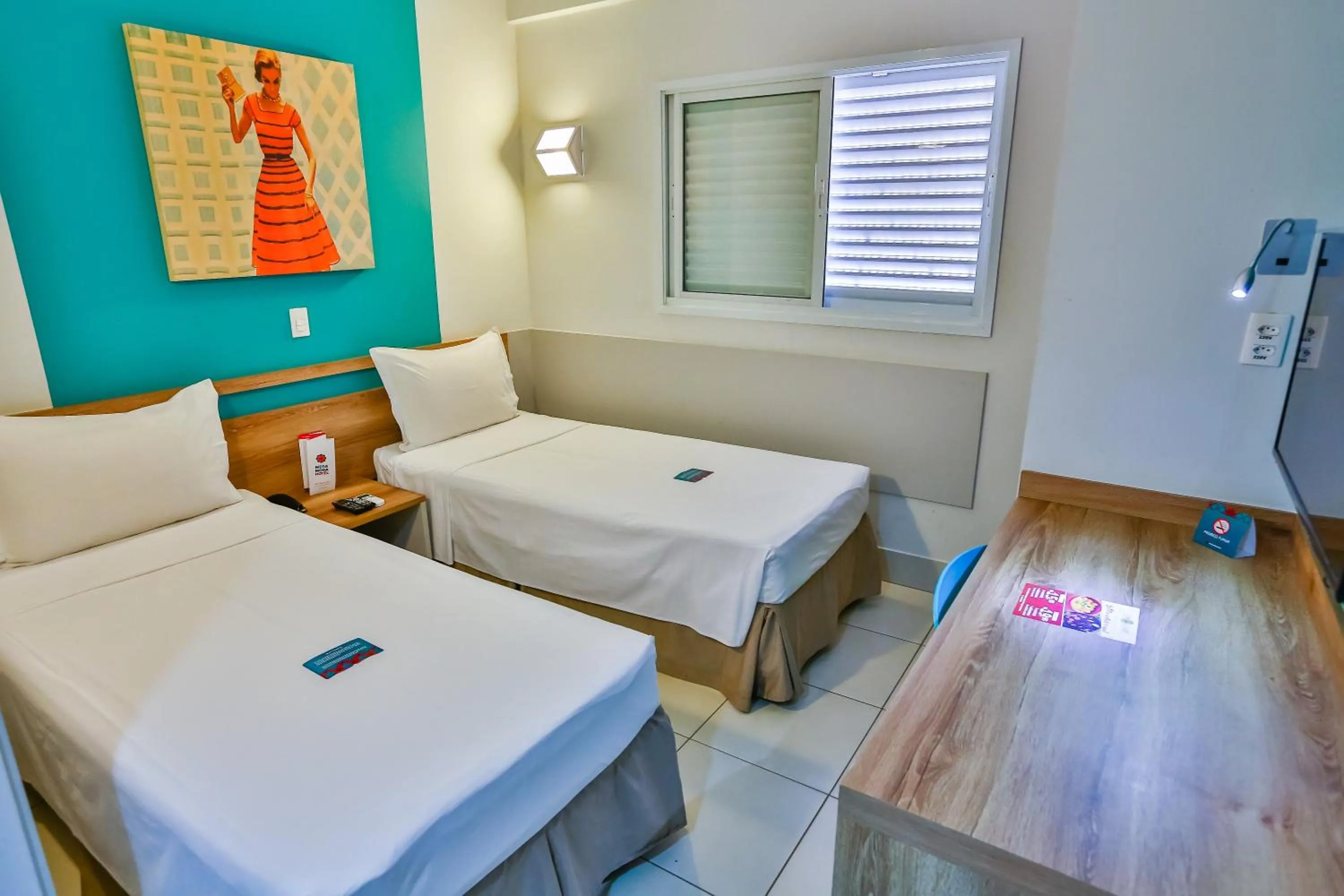 Bed in Mega Moda Goiania Hotel