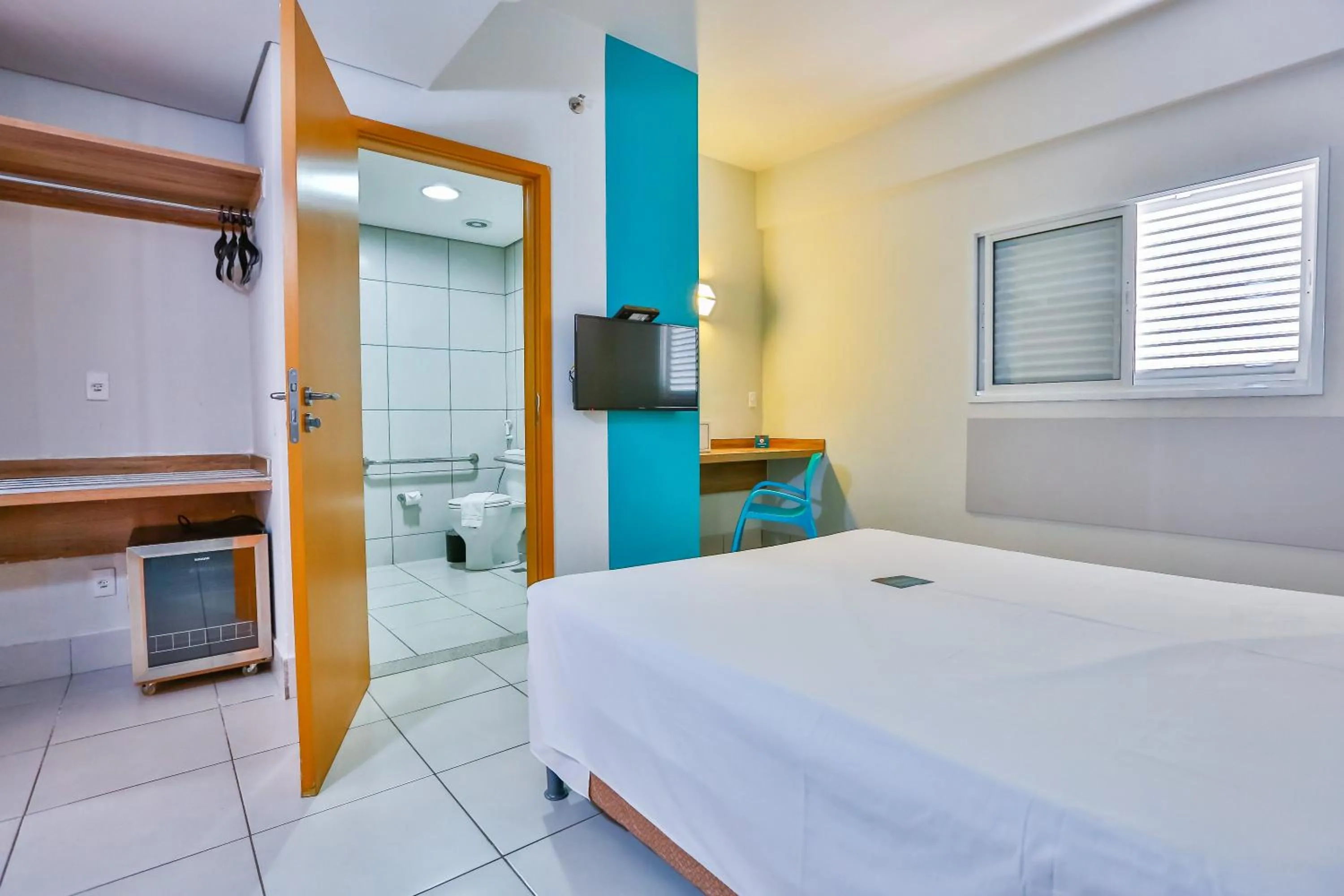 Bed in Mega Moda Goiania Hotel