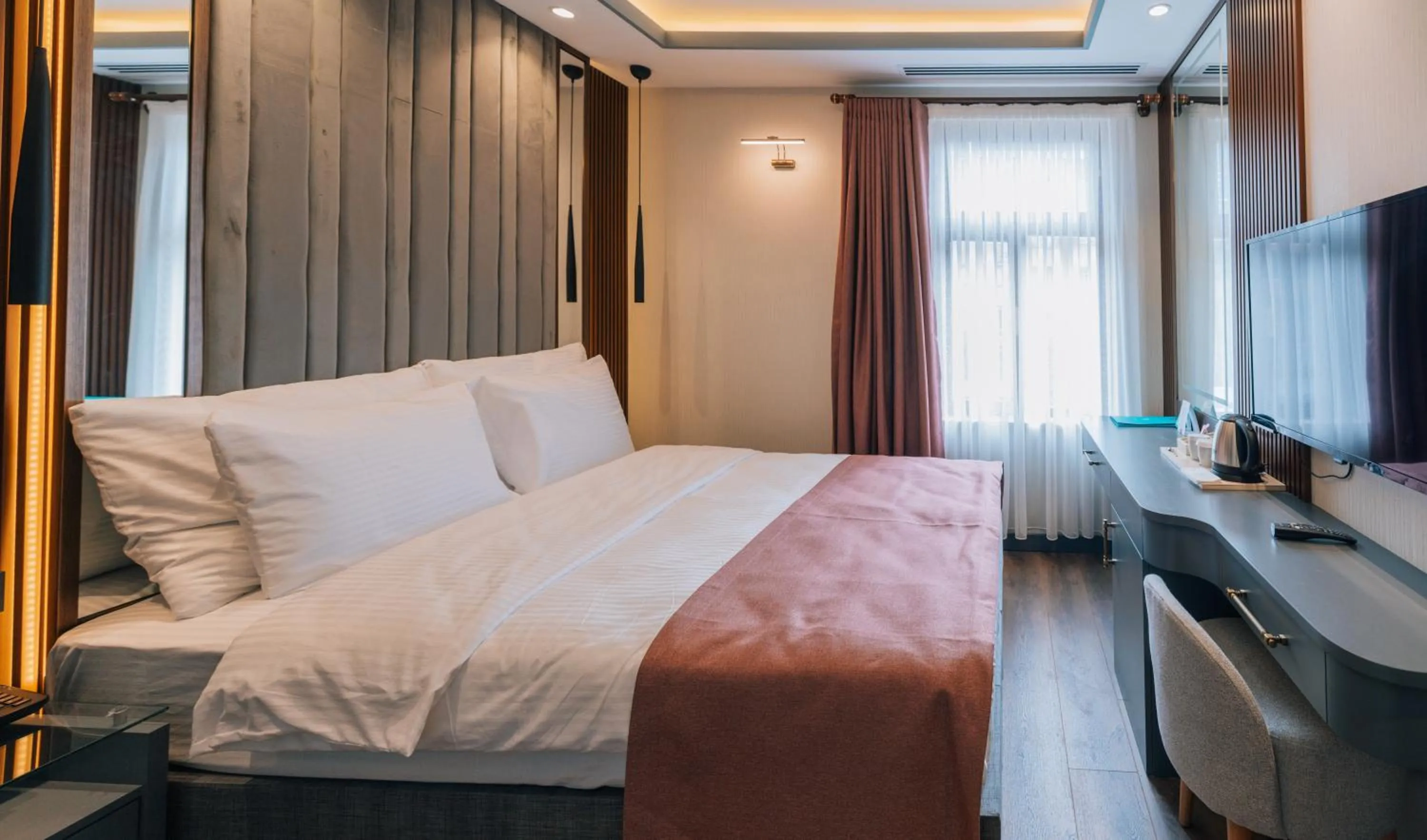 Bed in VE Hotels Adakale