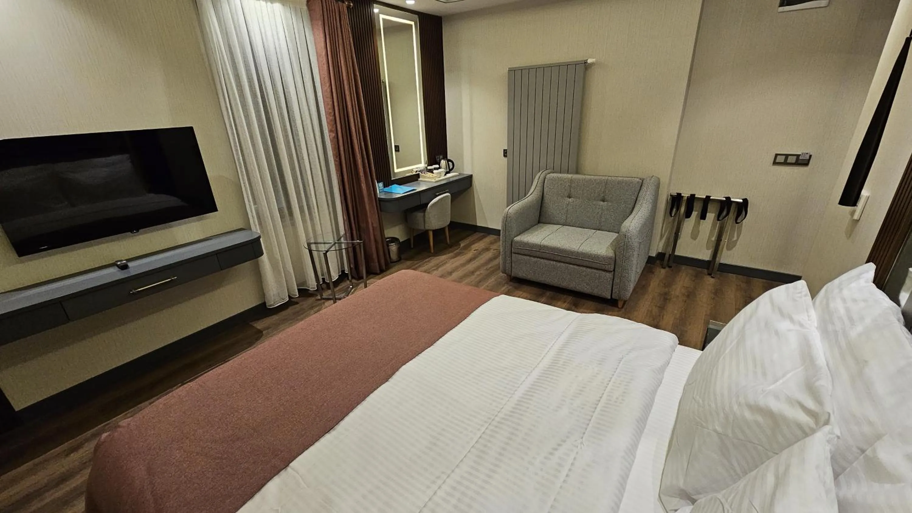 Bed in VE Hotels Adakale