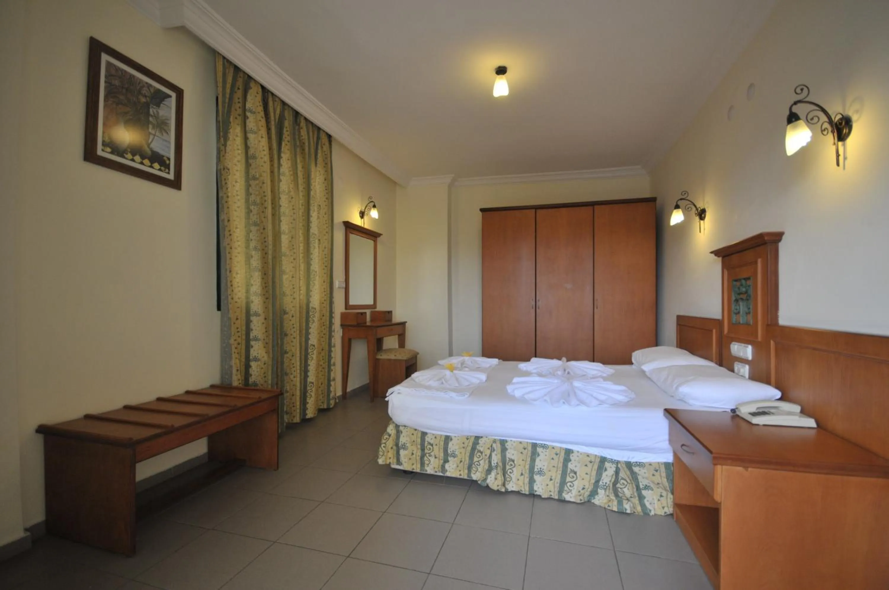 Bed in Aegean Princess Apartments And Studio