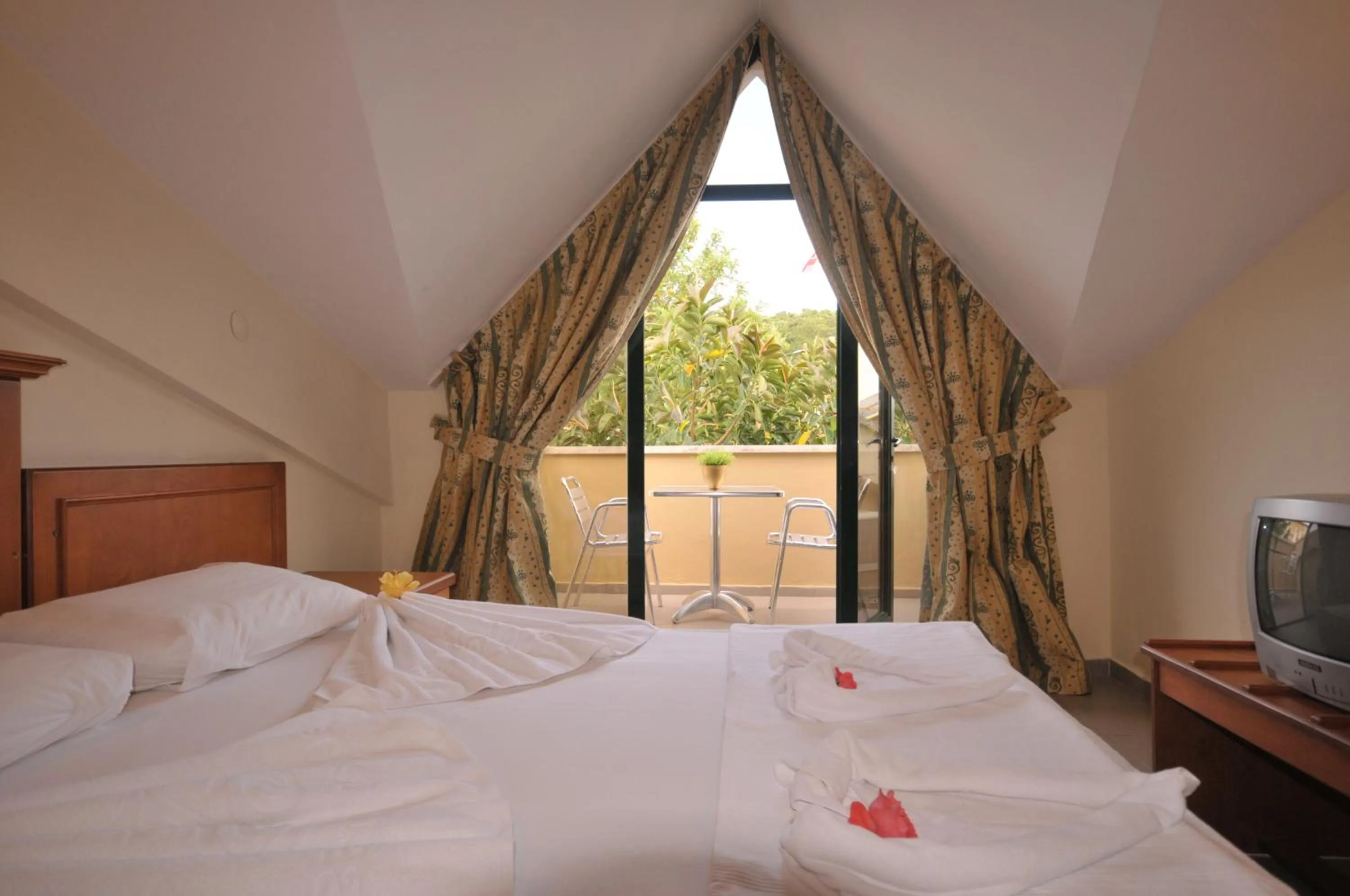 Bed in Aegean Princess Apartments And Studio