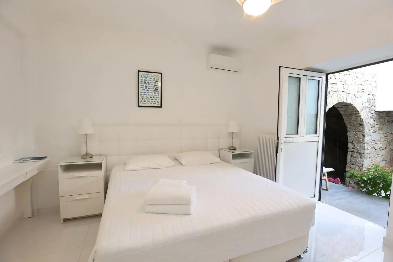 Bed in Adikri Villas & Suites