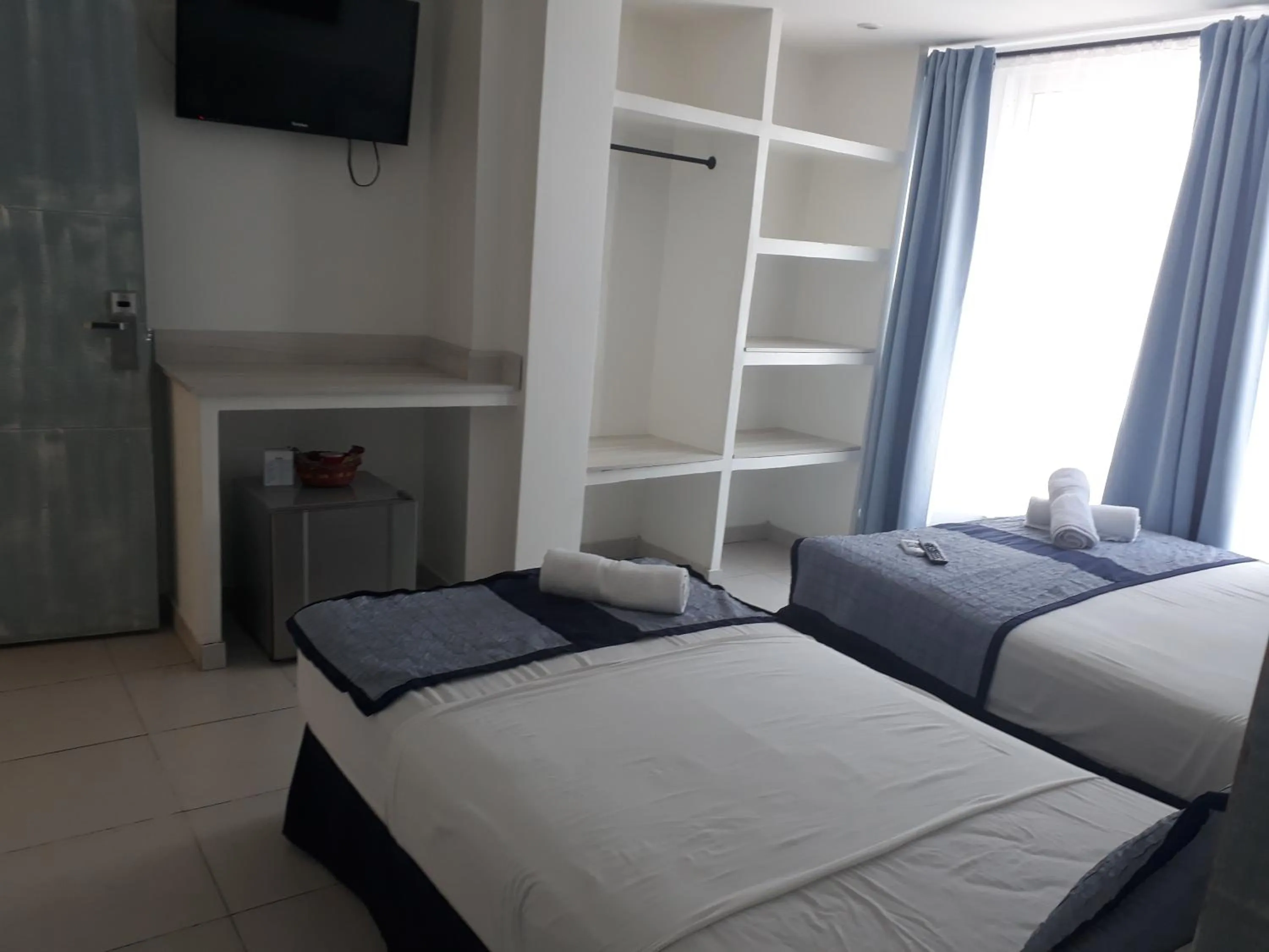 Photo of the whole room, Bed in Mintaka Hotel + Lounge