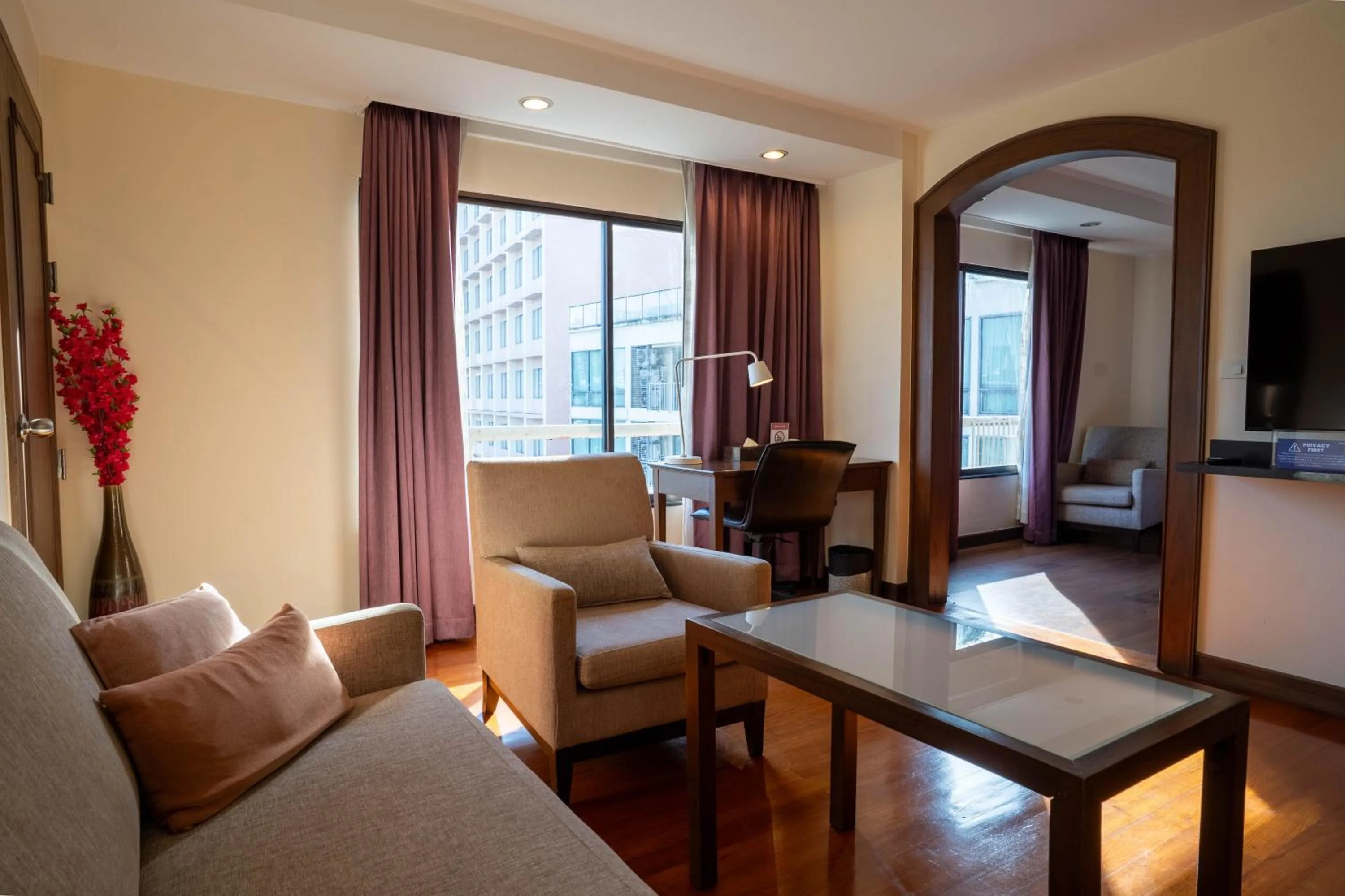 Living room in Journeyhub Sukhumvit 26, Bangkok - Formerly St James Hotel