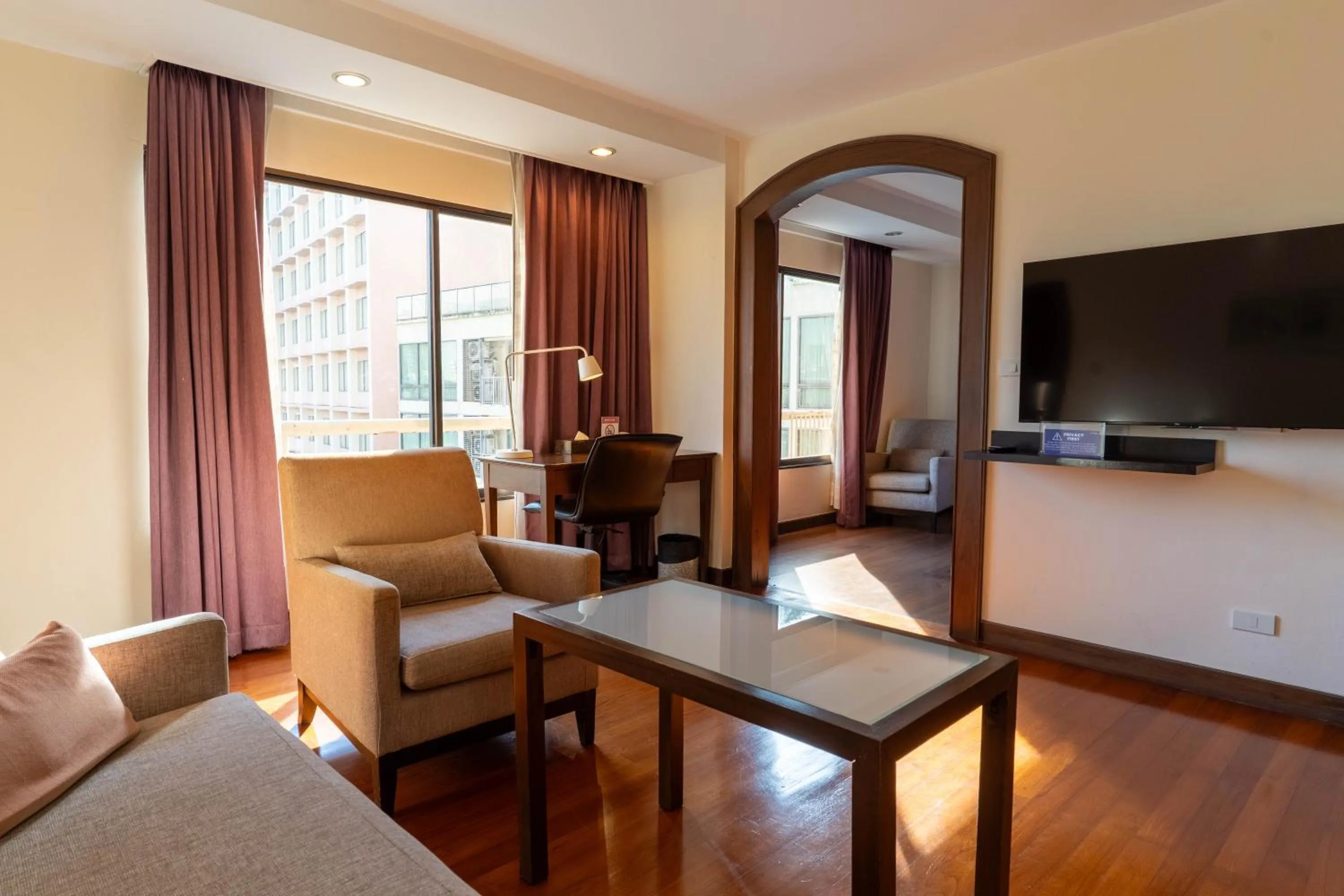 Living room in Journeyhub Sukhumvit 26, Bangkok - Formerly St James Hotel