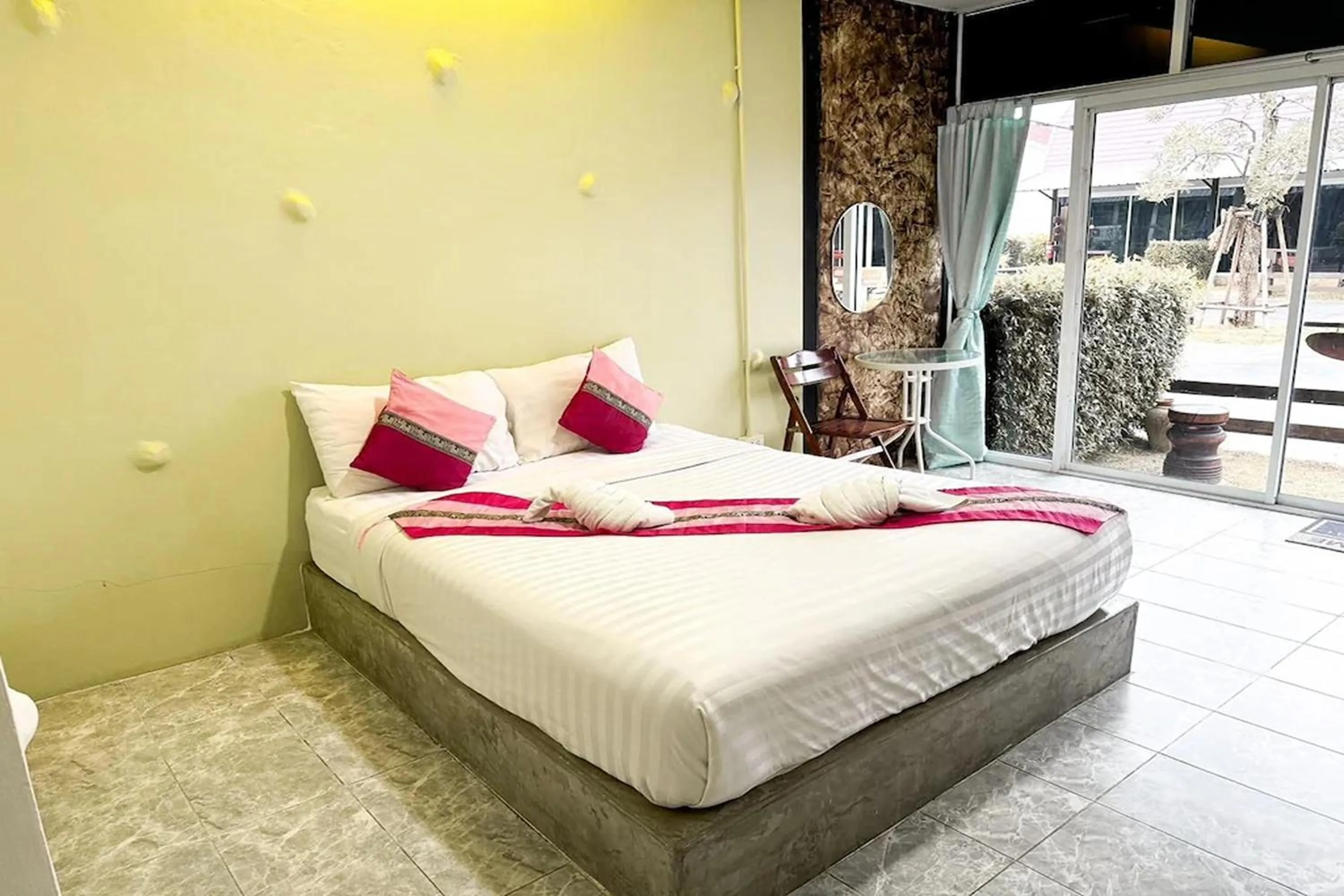 Bed in Pai Tawan Resort Hotel - Pet friendly