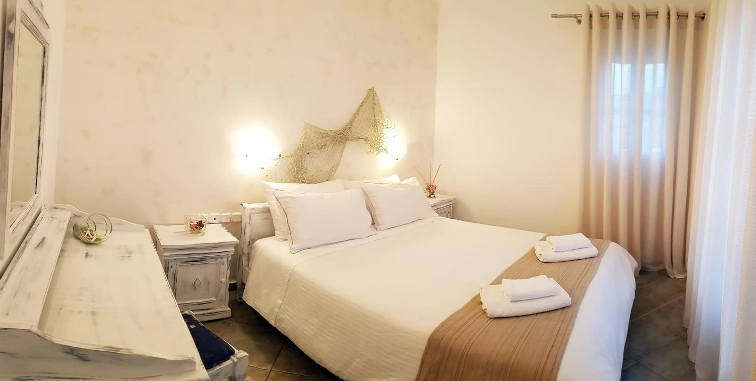 Bed in Paros Paradise Apartments