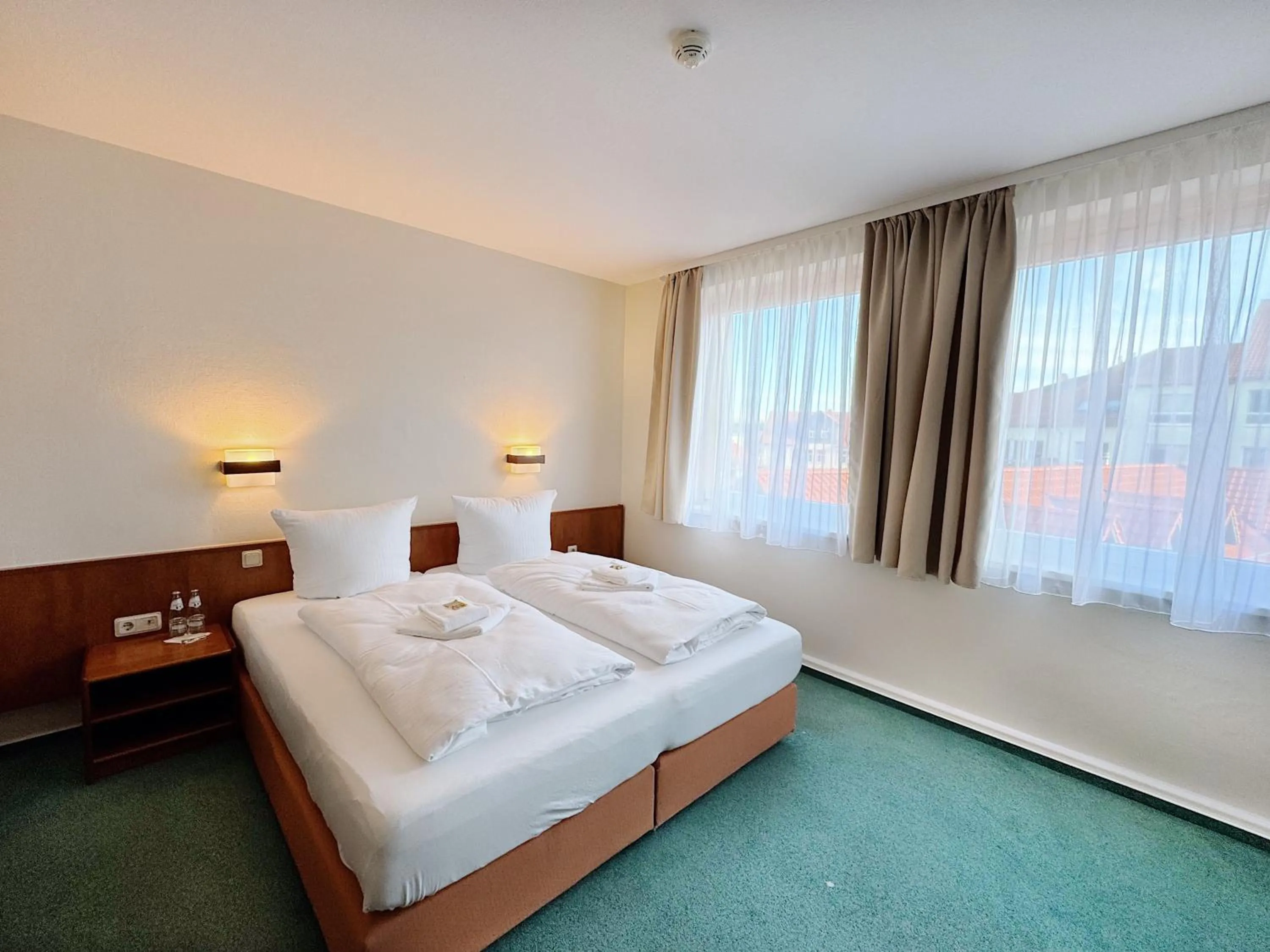 Bed in REGIOHOTEL Bunte Stadt Wernigerode - #DirektInDerAltstadt #PrimaFrühstück #TopPreisLeistung #FrischRenoviert