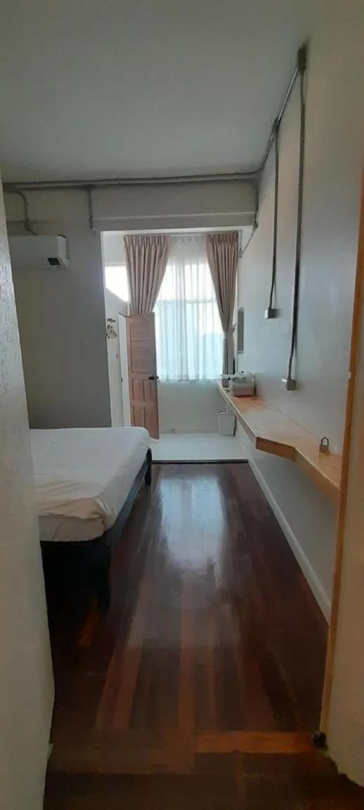 Bed in To The Moon Guesthouse