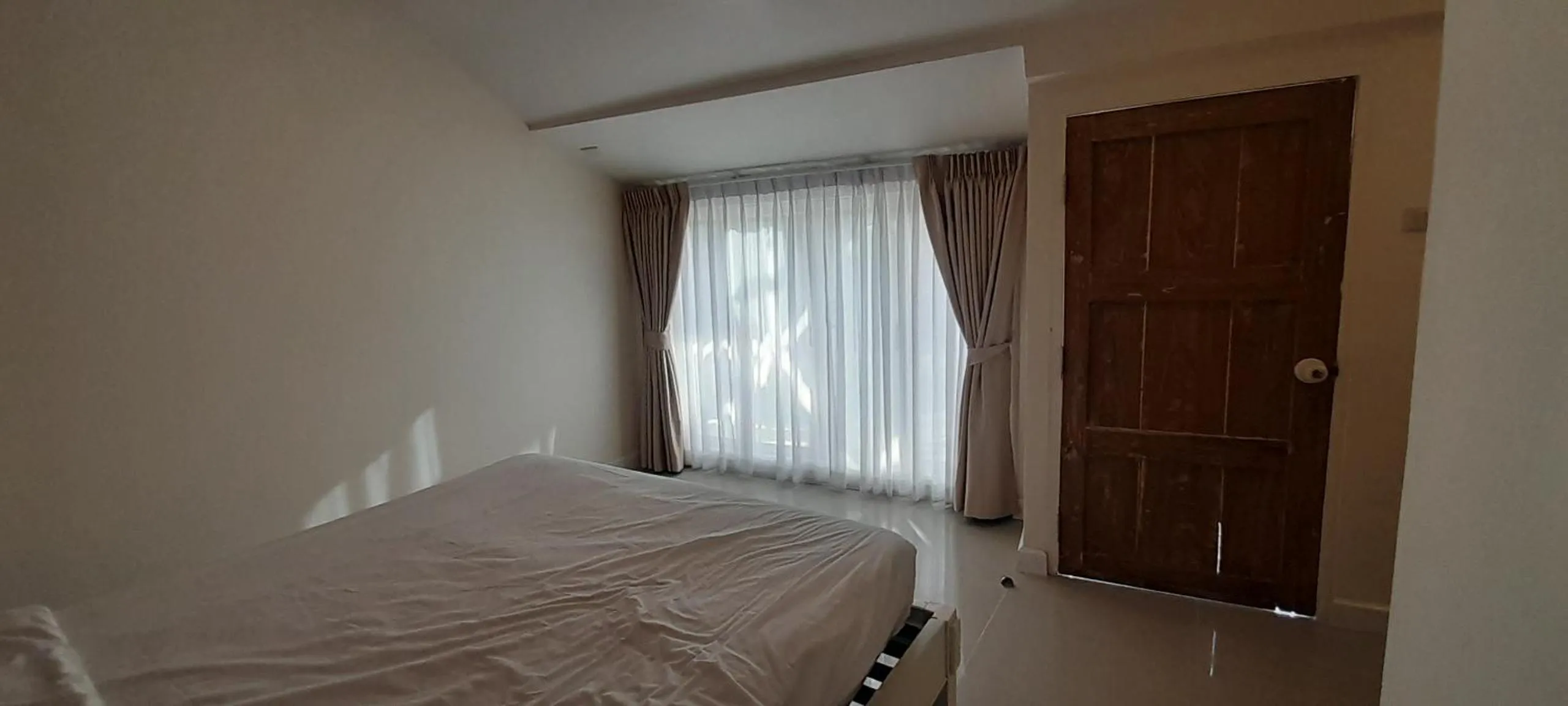 Bed in To The Moon Guesthouse