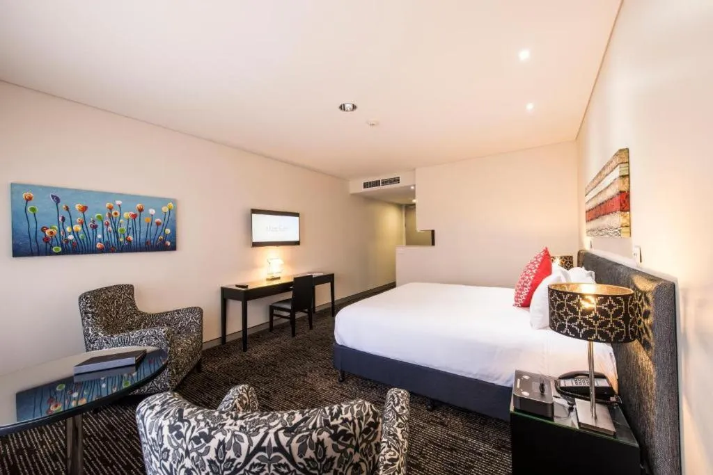 Photo of the whole room, Bed in Calamvale Hotel Suites and Conference Centre