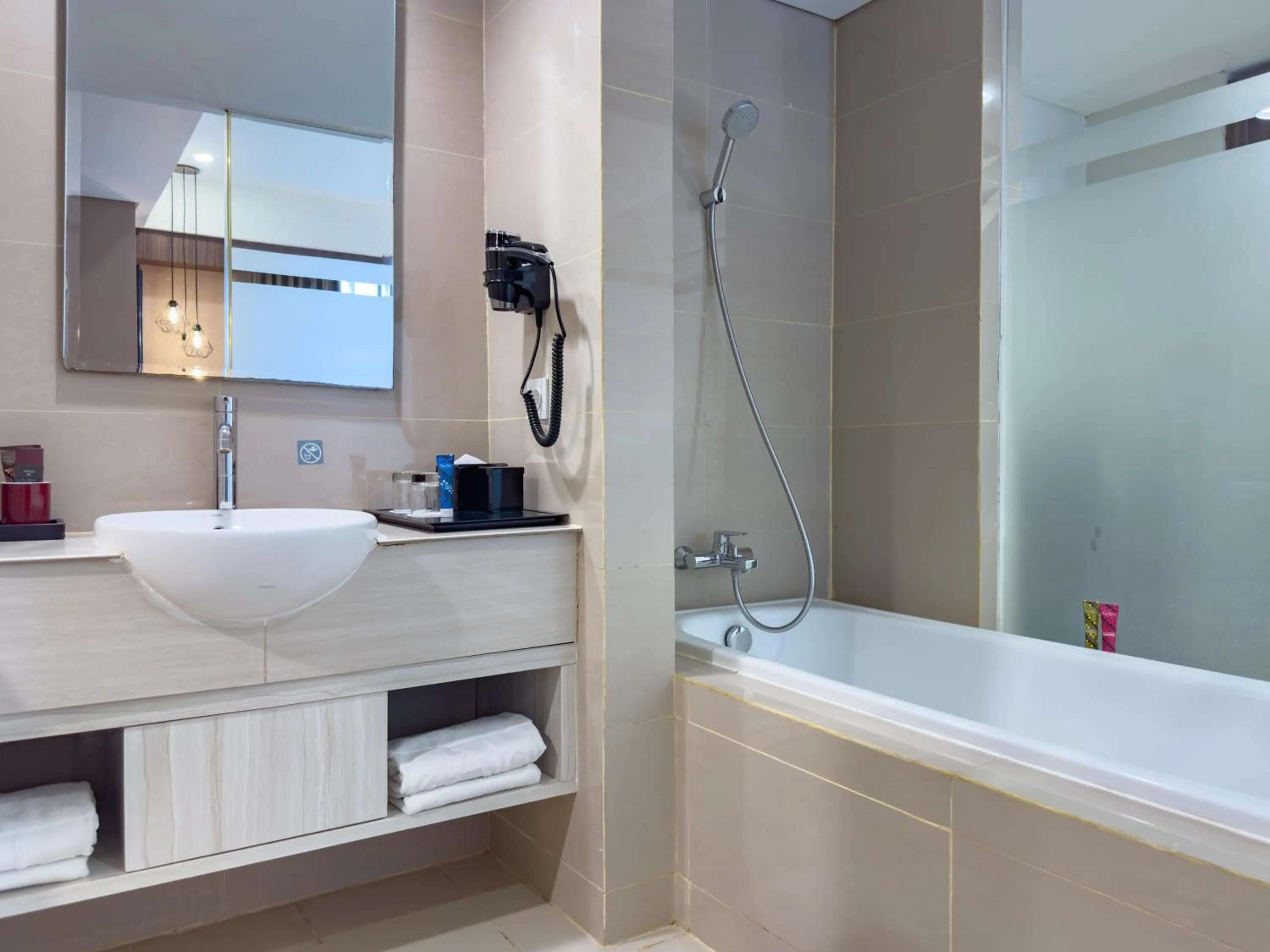 Bathroom in The Alana Hotel & Conference Center Malioboro Yogyakarta by ASTON