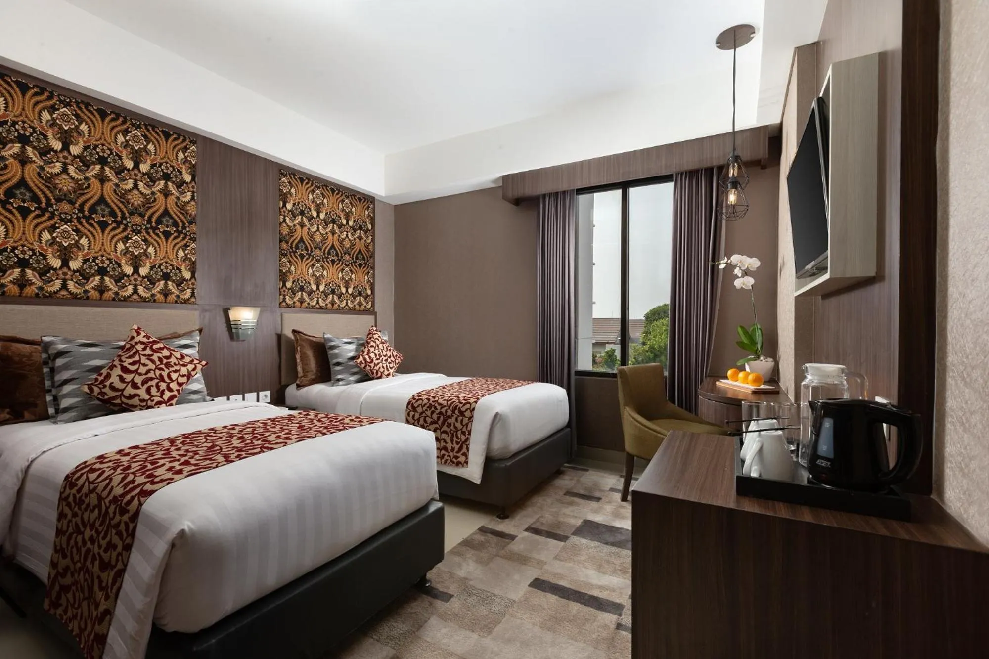 Bed in The Alana Hotel & Conference Center Malioboro Yogyakarta by ASTON