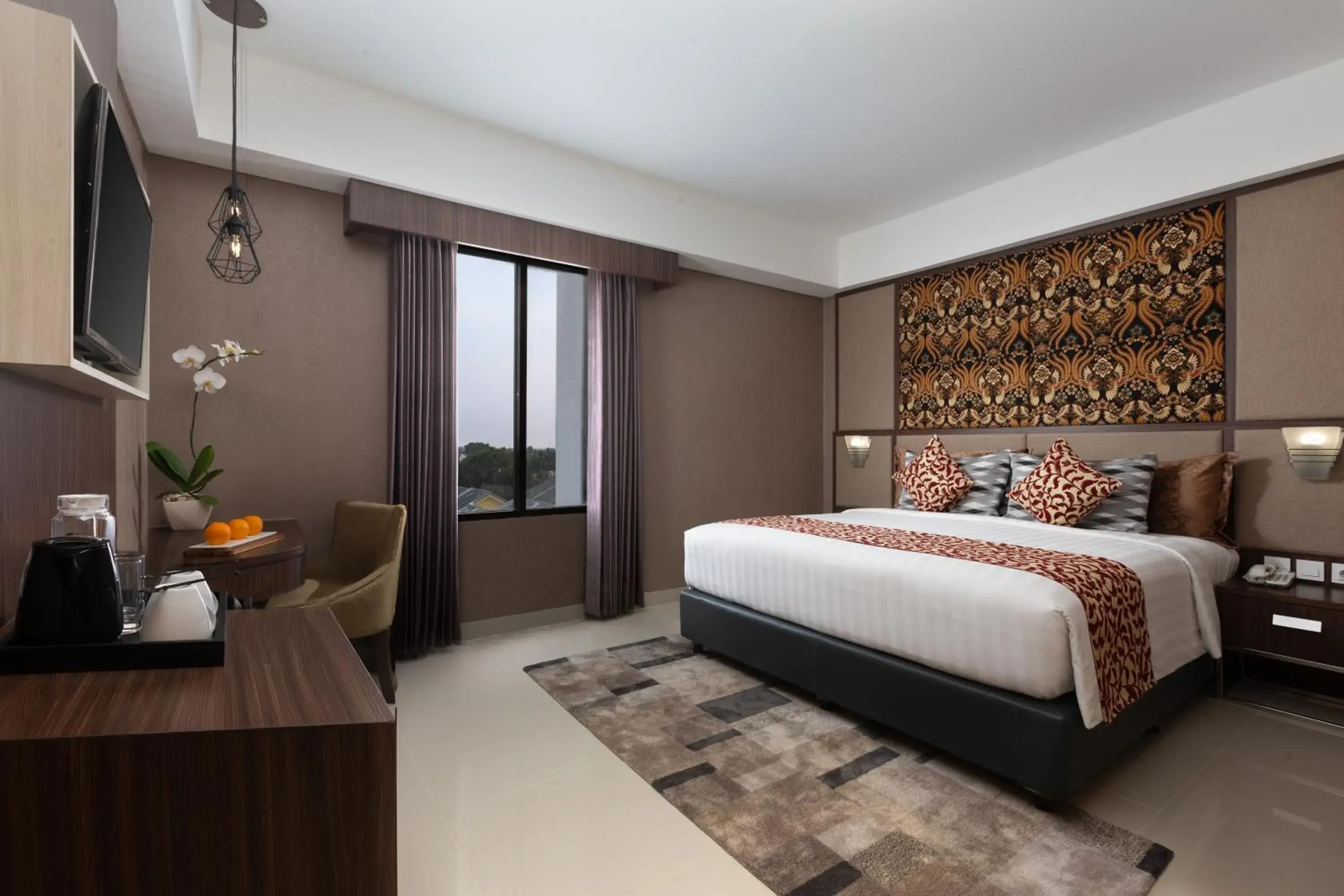 Bed in The Alana Hotel & Conference Center Malioboro Yogyakarta by ASTON Bed in The Alana Hotel & Conference Center Malioboro Yogyakarta by ASTON