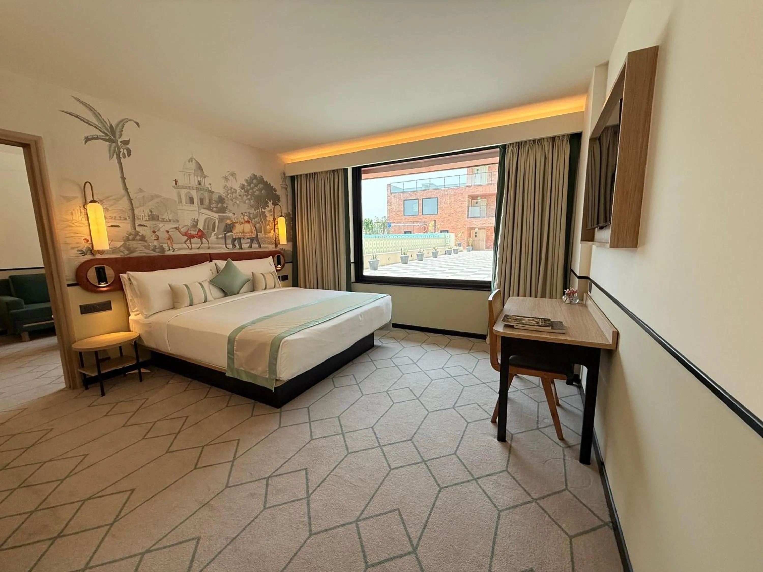 Seating area, Bed in Holiday Inn Gurgaon NH8 by IHG