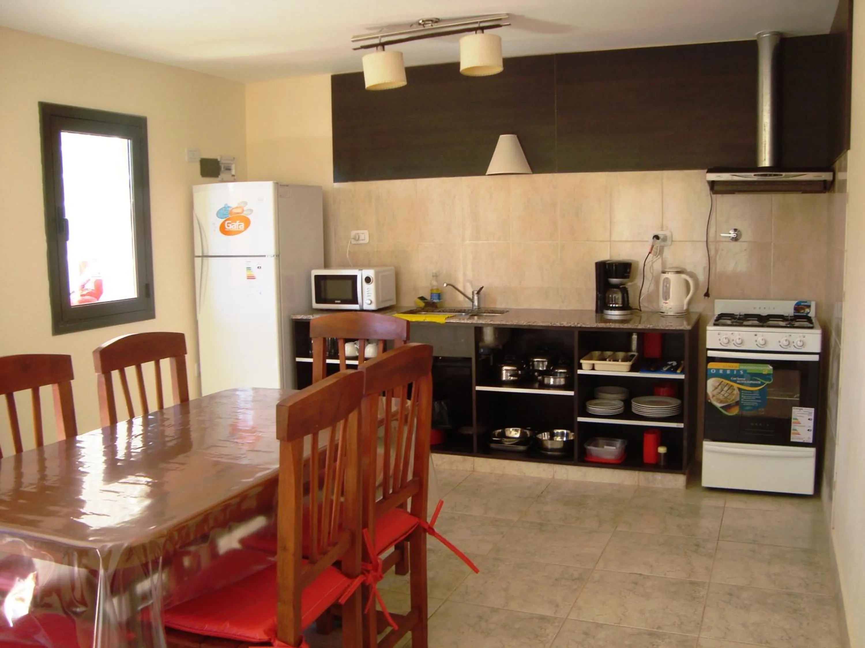 Kitchen or kitchenette in Miralagos Apart & Cabañas