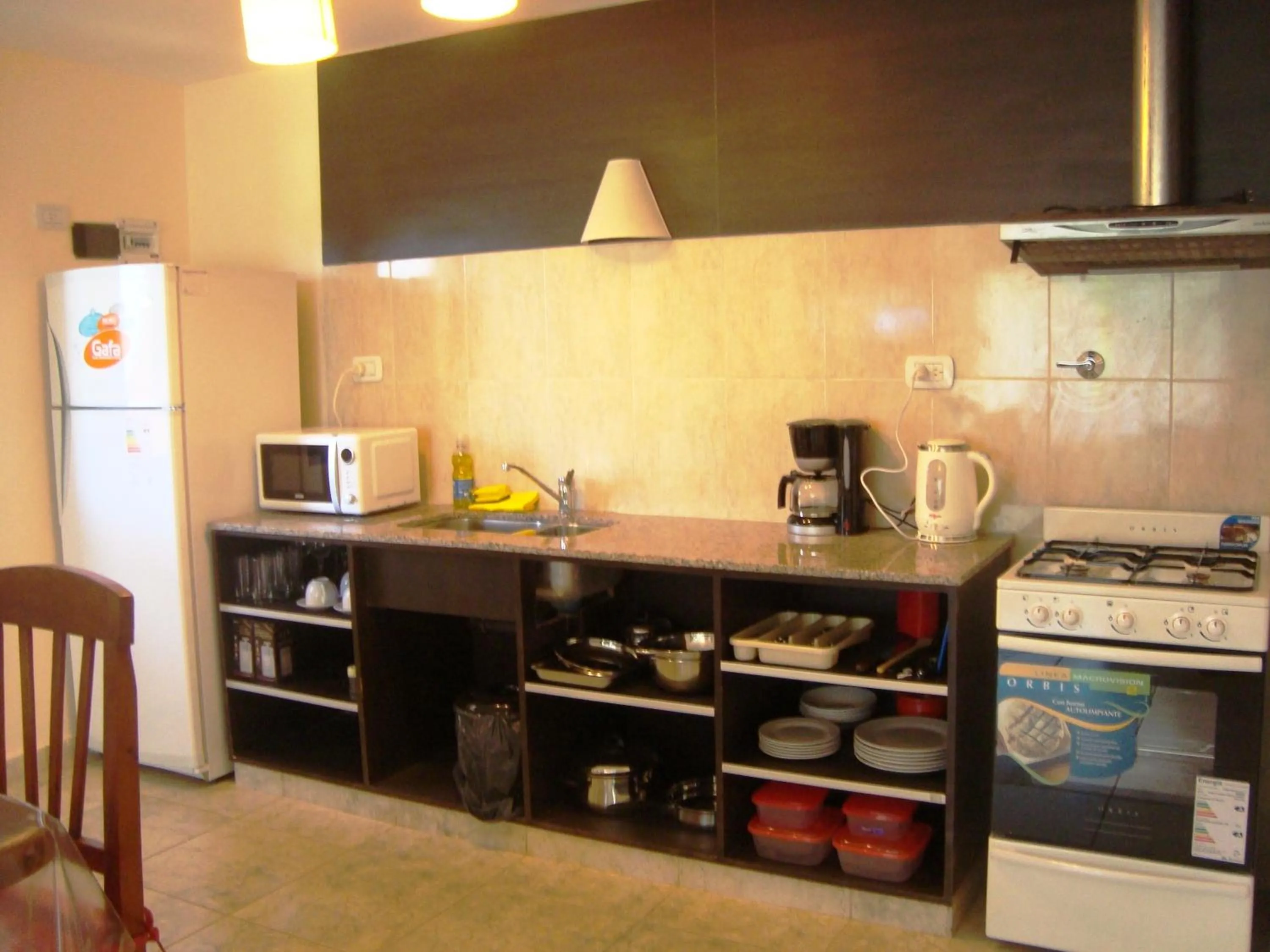 Kitchen or kitchenette in Miralagos Apart & Cabañas