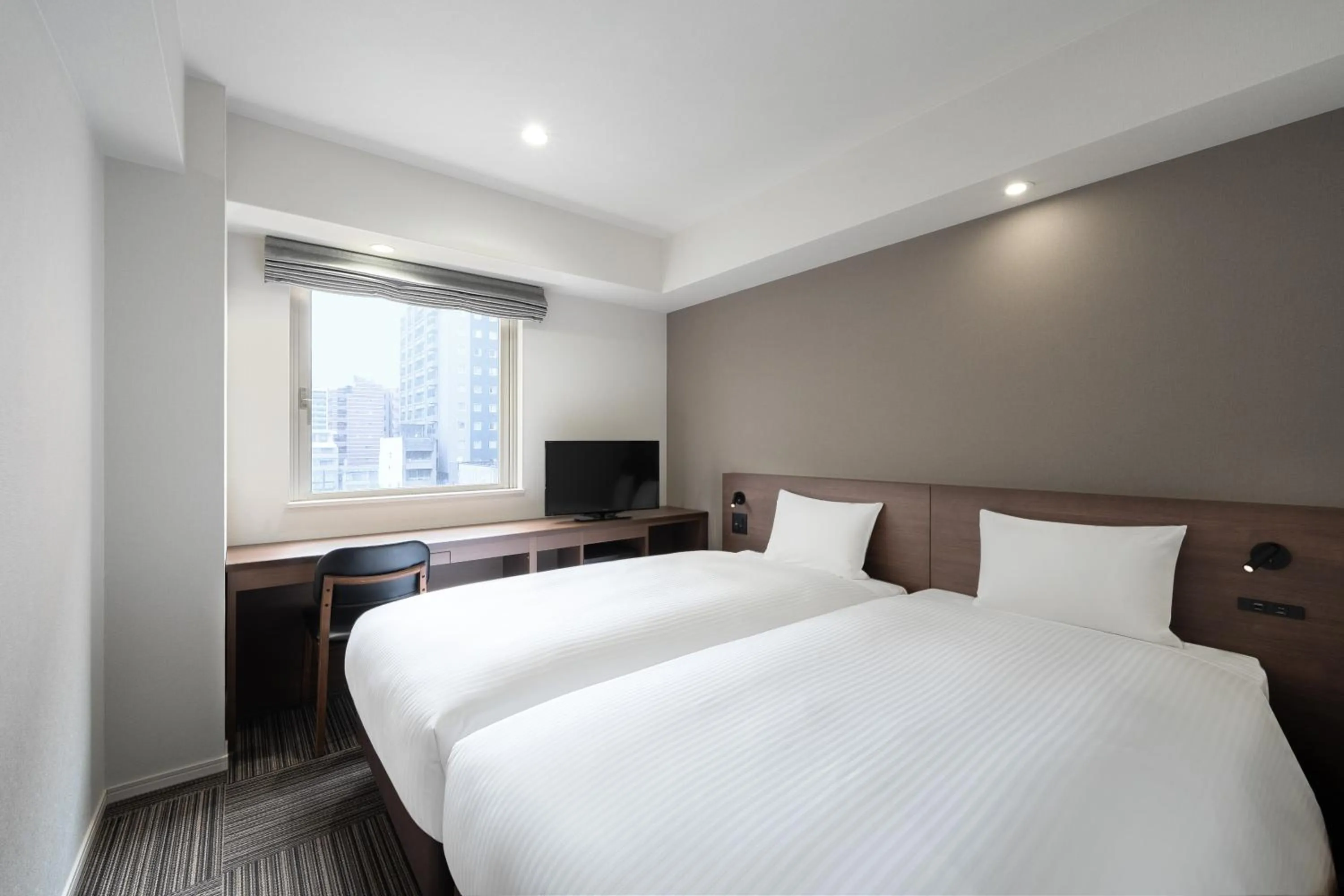 Bed in Hotel Oriental Express Kagoshima Tenmonkan