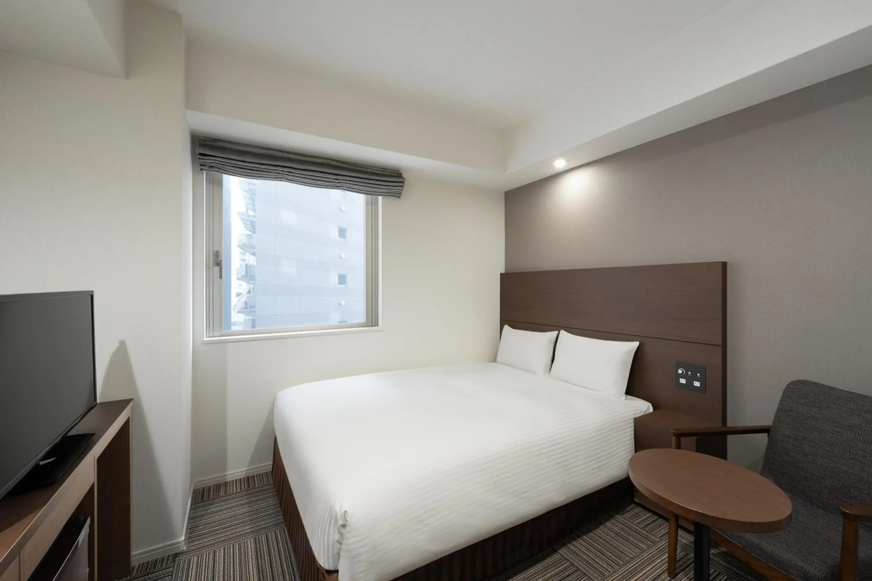 Bed in Hotel Oriental Express Kagoshima Tenmonkan Bed in Hotel Oriental Express Kagoshima Tenmonkan