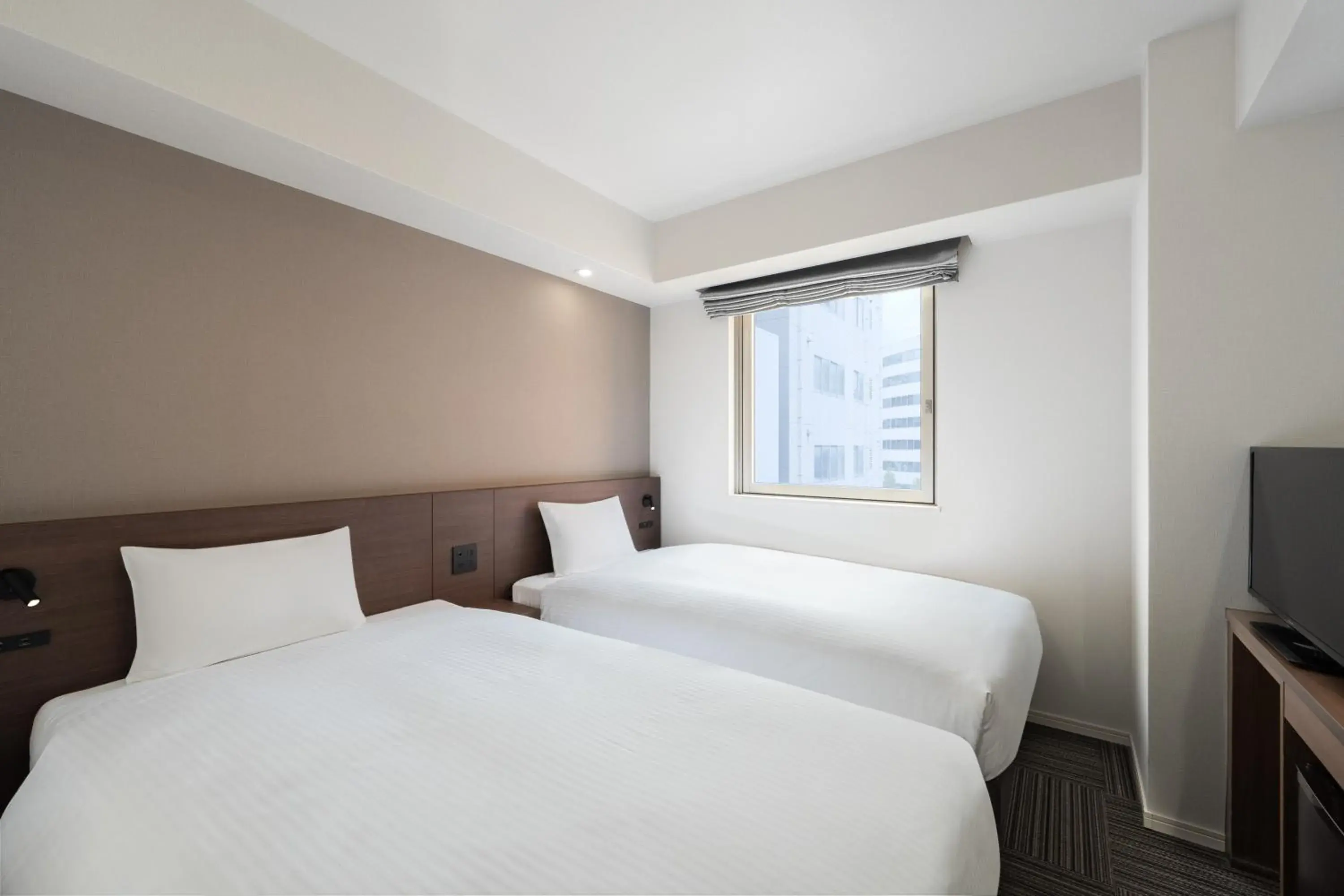 Bed in Hotel Oriental Express Kagoshima Tenmonkan Bed in Hotel Oriental Express Kagoshima Tenmonkan