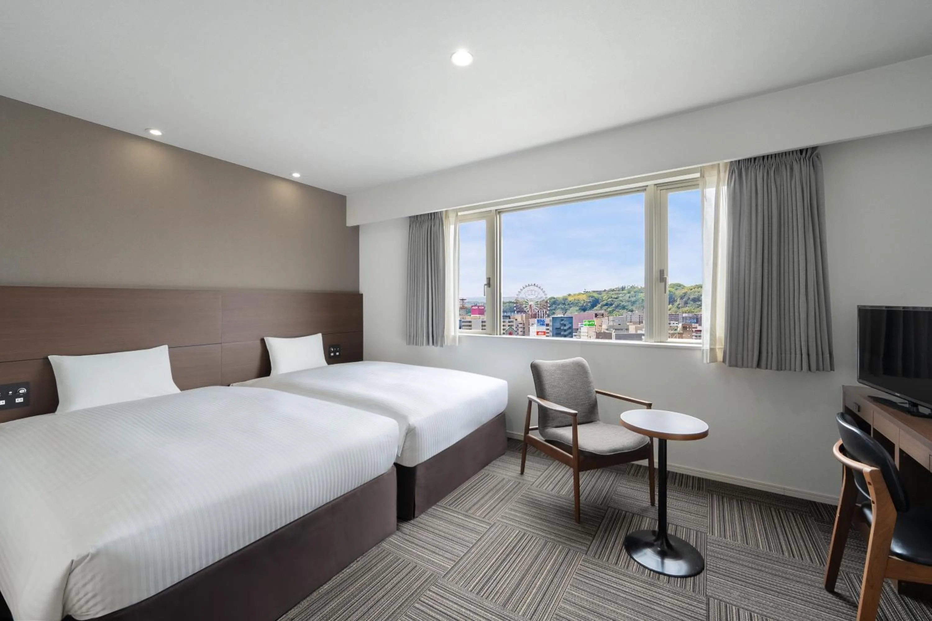 Bed in Hotel Oriental Express Kagoshima Tenmonkan