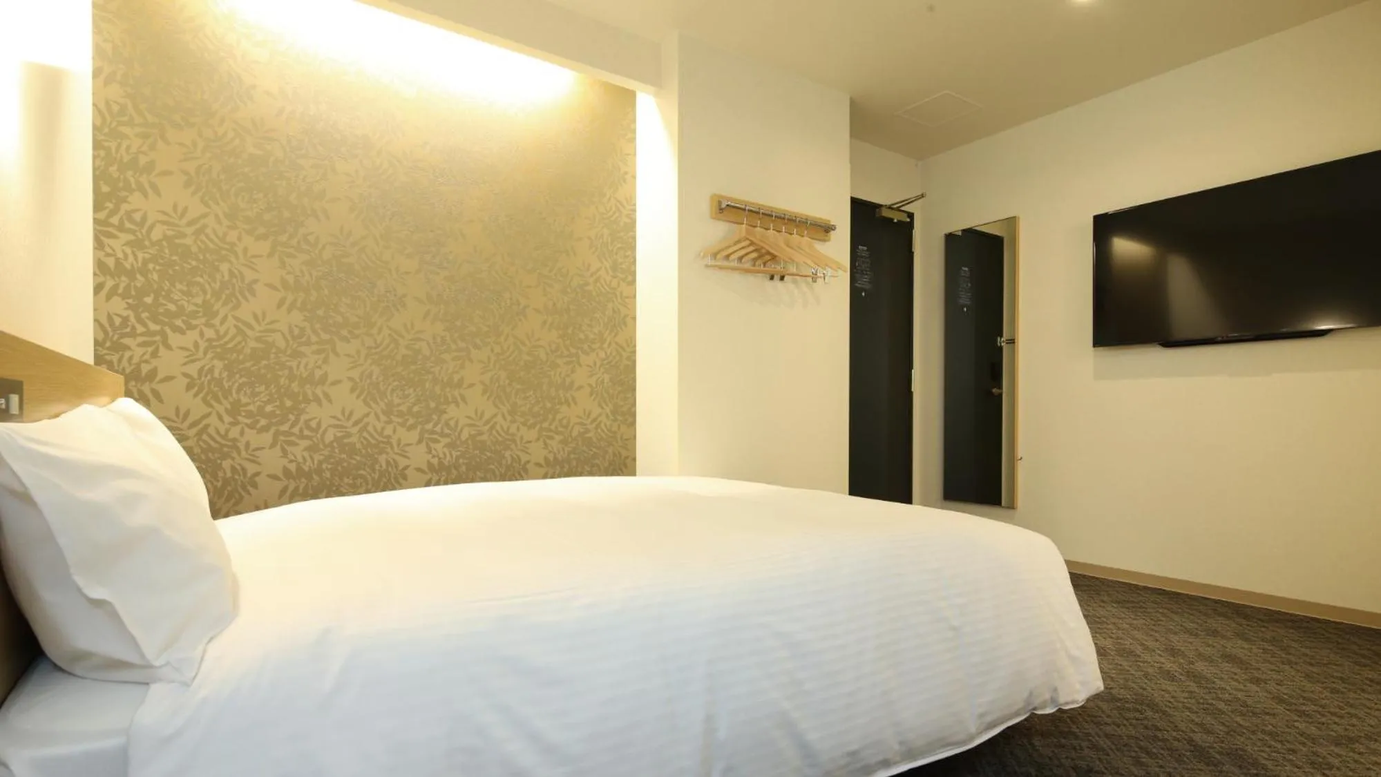 Bed in AB Hotel Sakaihigashi