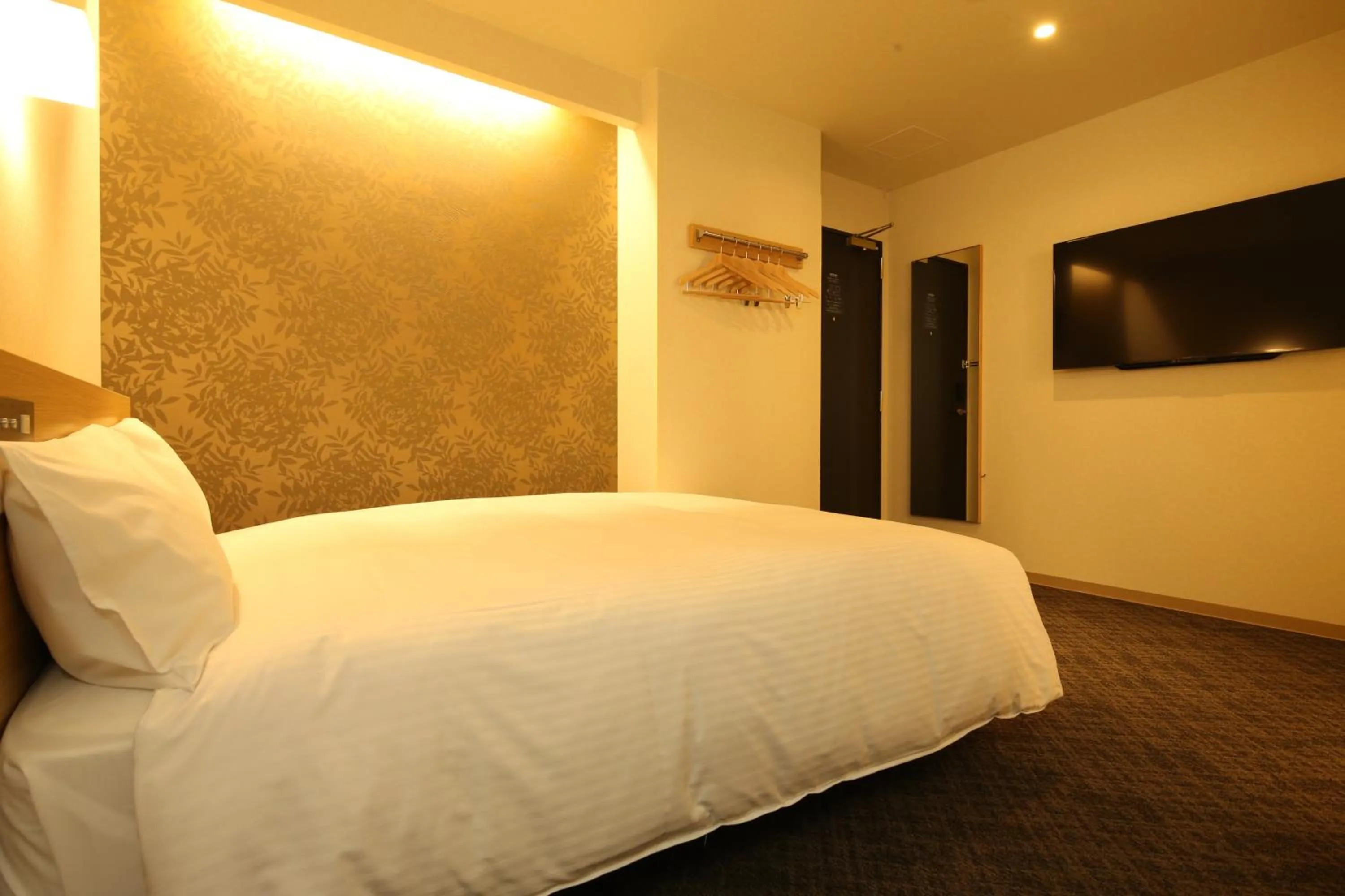 Bed in AB Hotel Sakaihigashi