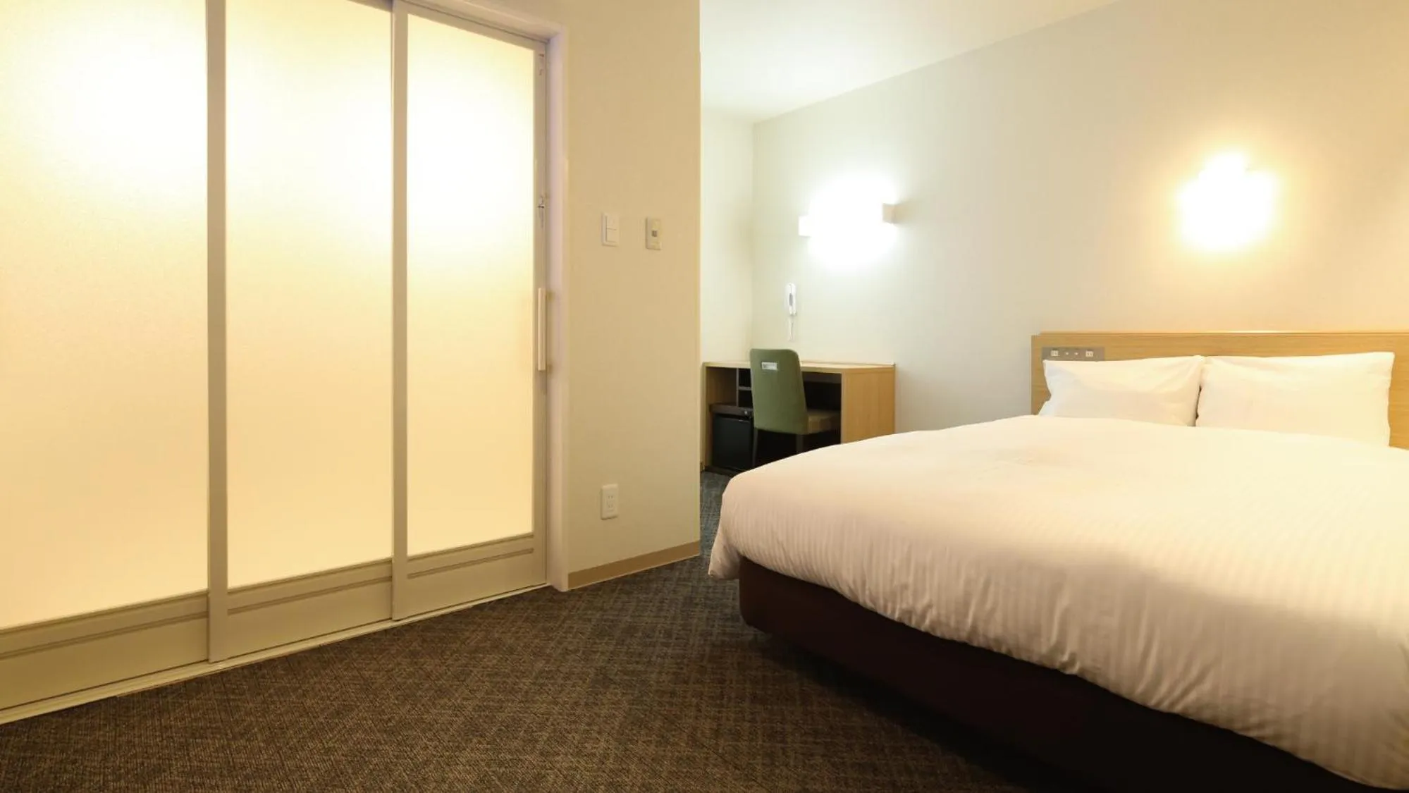 Bed in AB Hotel Sakaihigashi