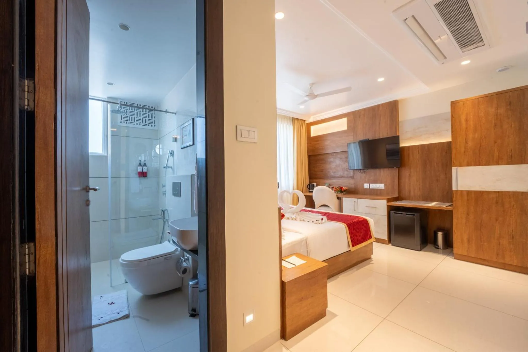 Toilet, Bed in Ramee Tarang Hotel Indore