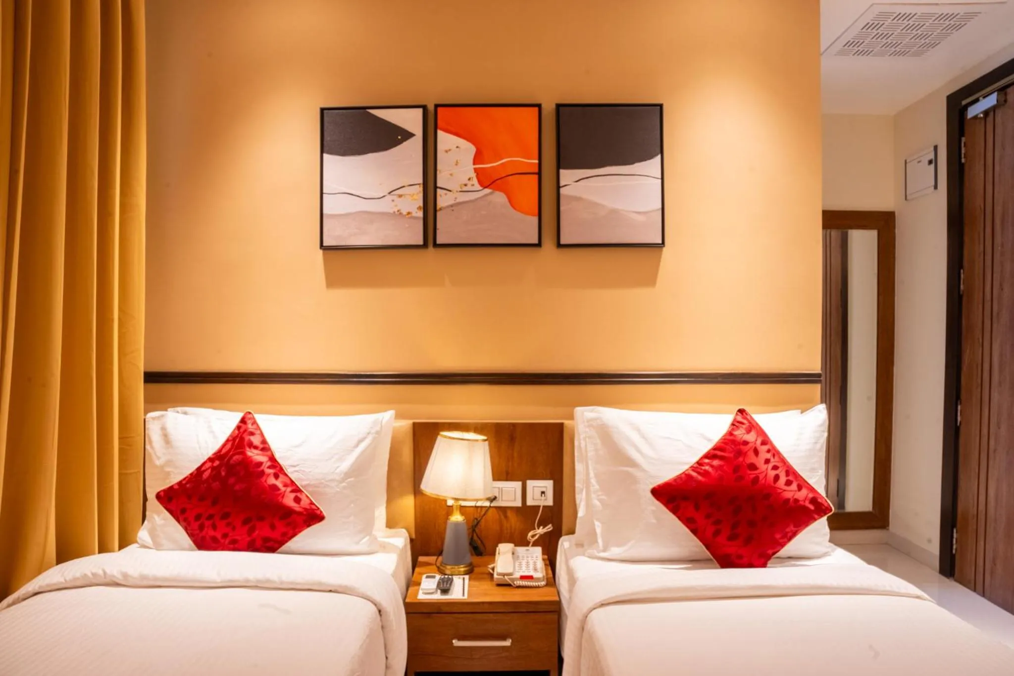 Bed in Ramee Tarang Hotel Indore