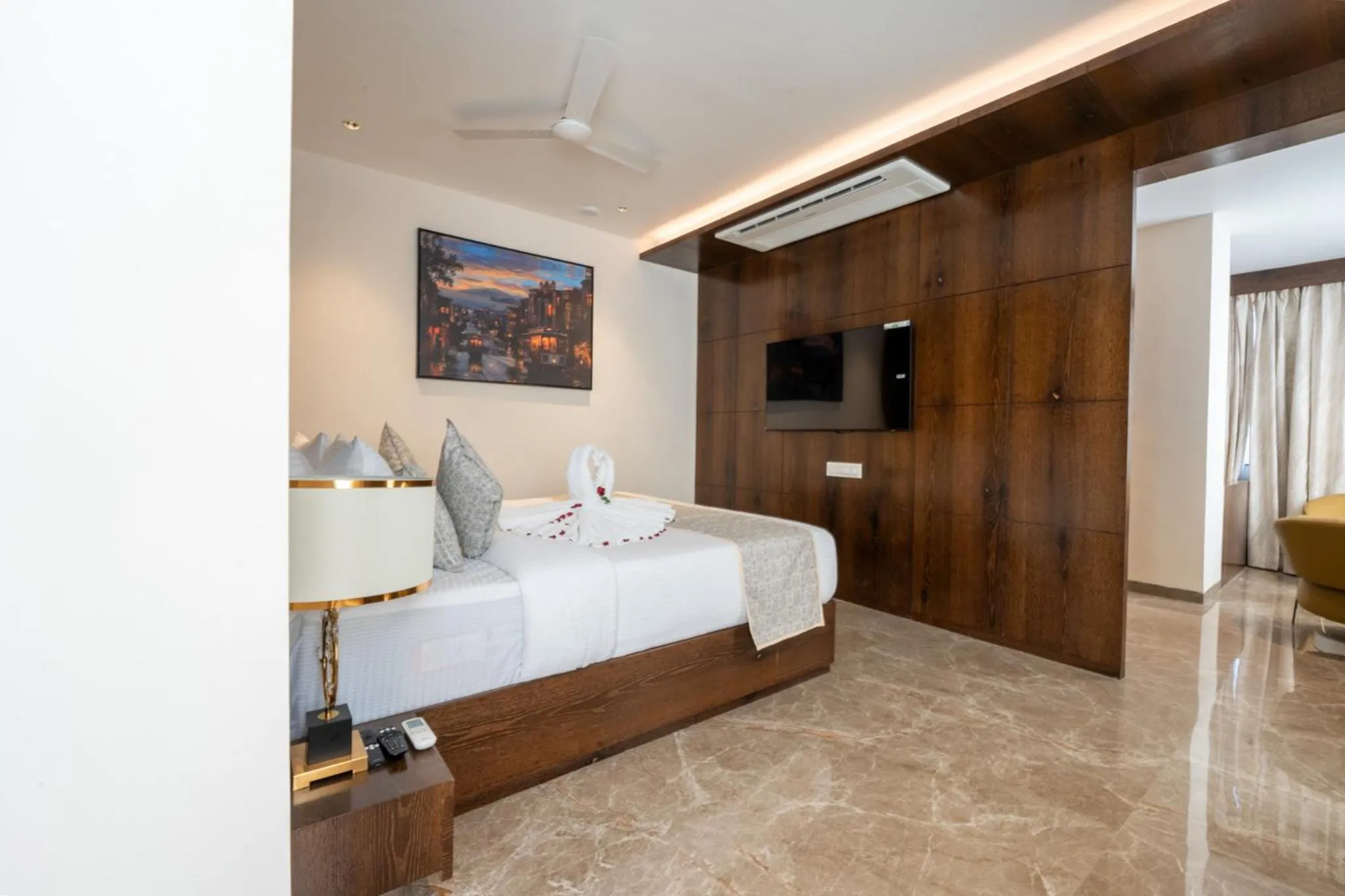 Bed in Ramee Tarang Hotel Indore