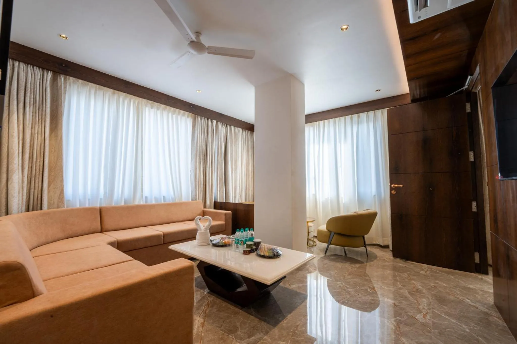 Seating area in Ramee Tarang Hotel Indore
