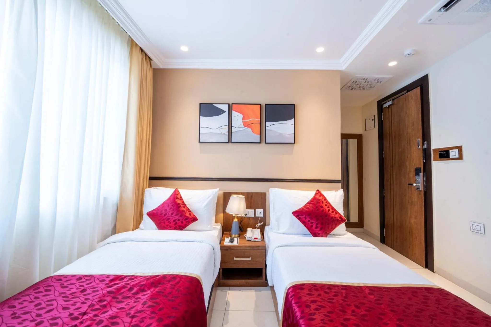 Bed in Ramee Tarang Hotel Indore