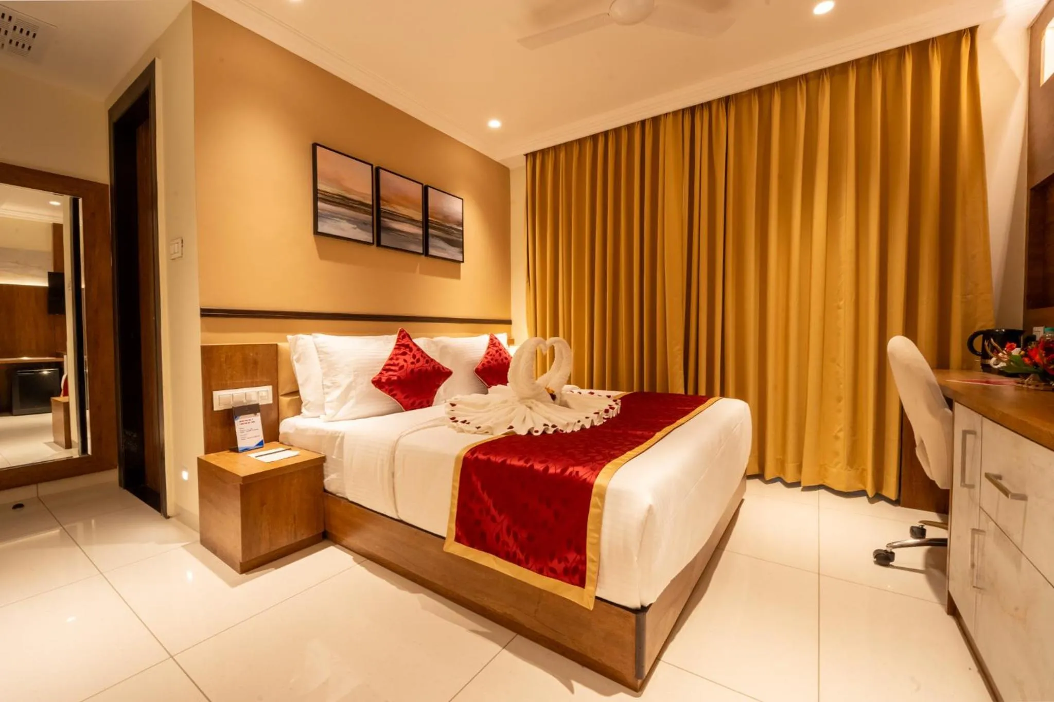 Bed in Ramee Tarang Hotel Indore