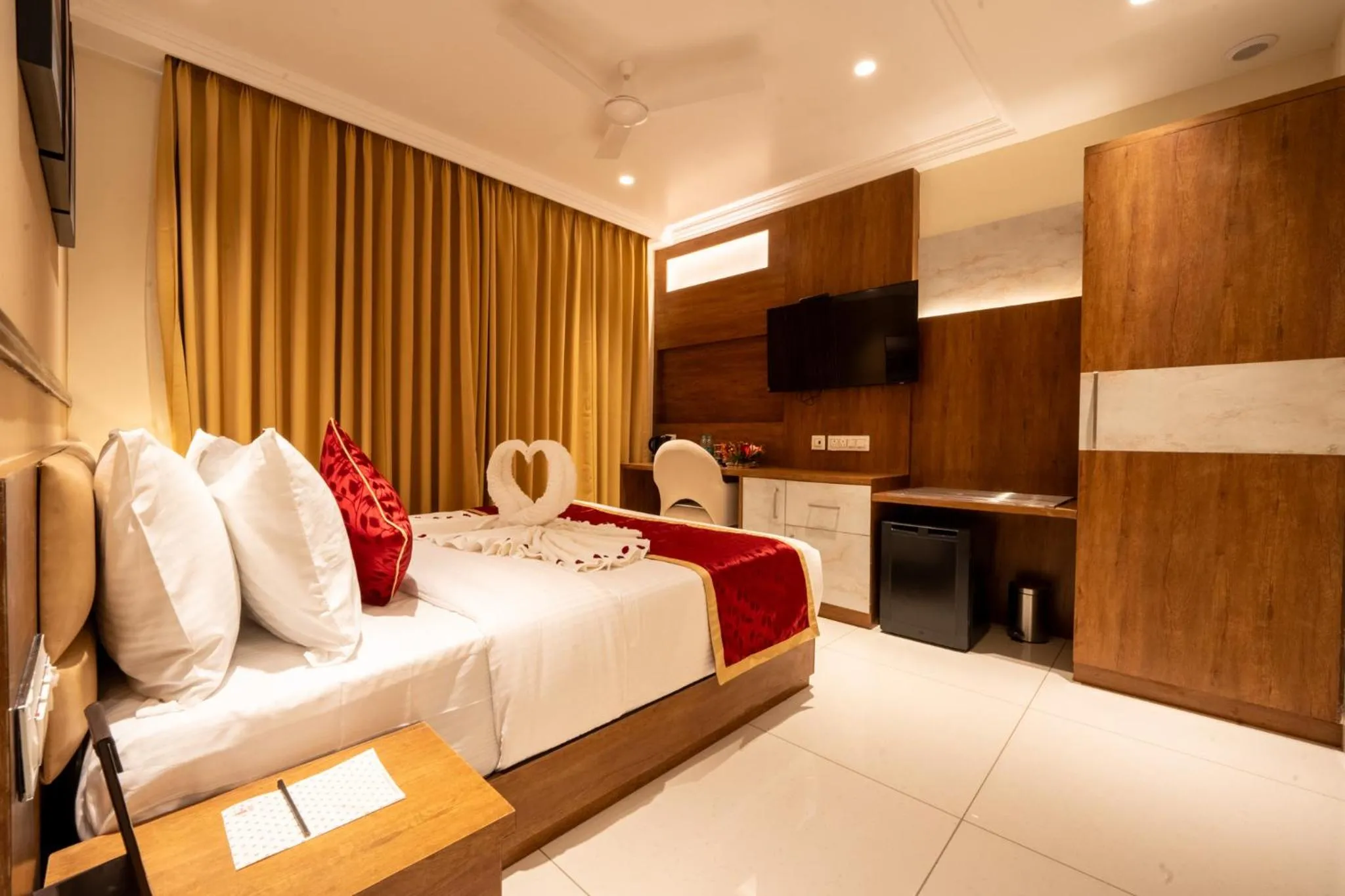 Bed in Ramee Tarang Hotel Indore